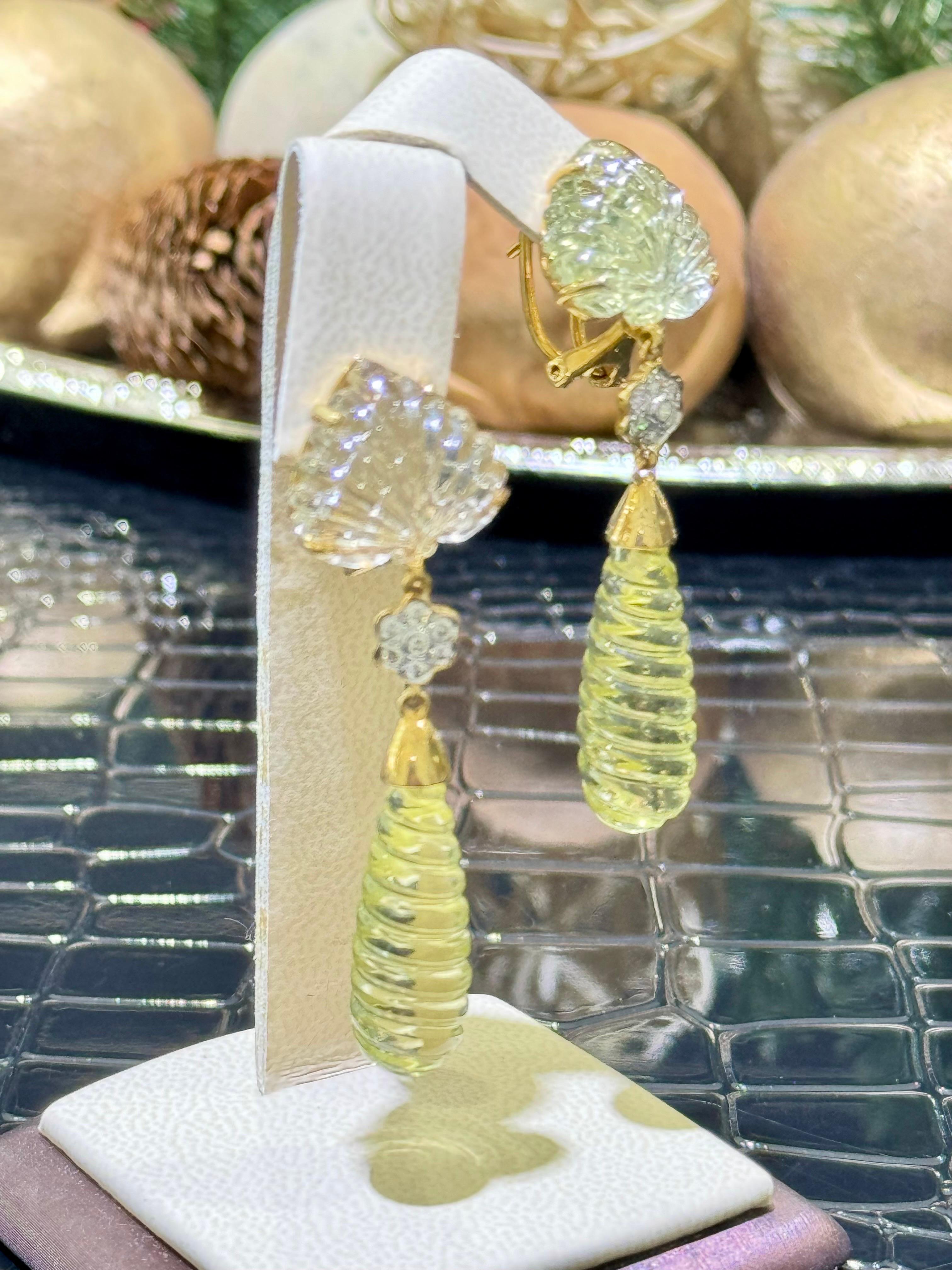 Breathtaking Citrine & Diamond Earrings In 18k.

Unique carving on a Citrines.

Approximately 0.42 carats in diamonds,

Hanging length is approximately 2 1/4”.