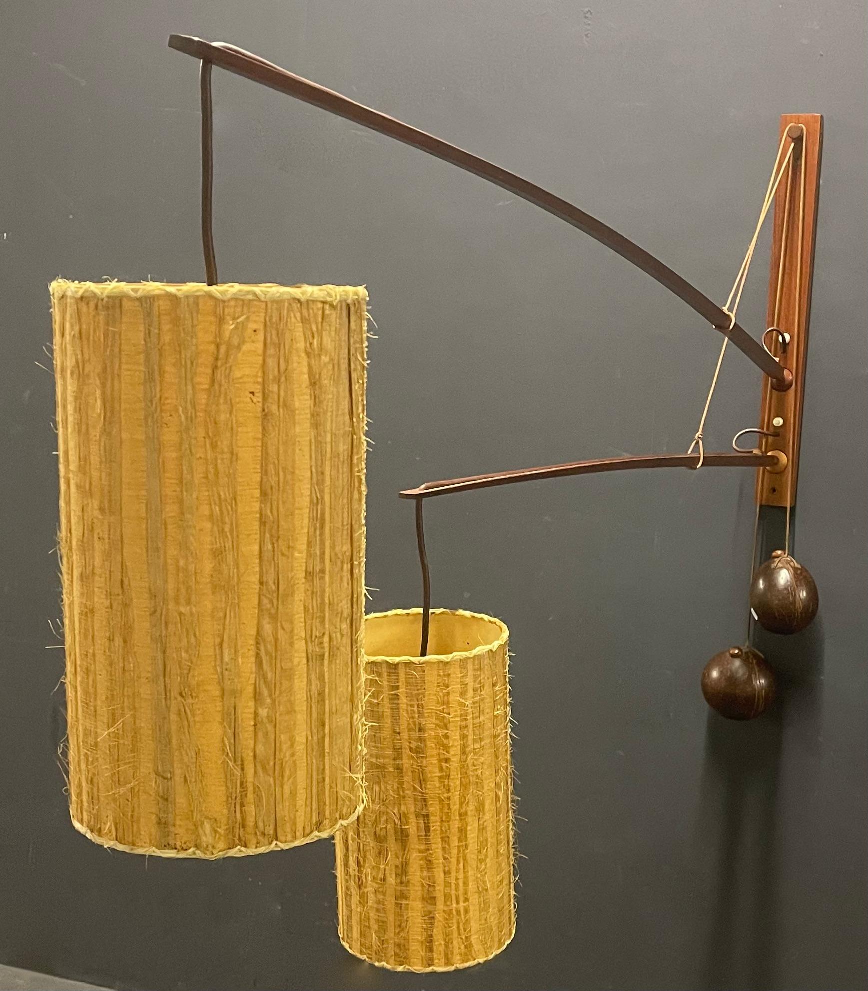 wonderful teakwood wall lamp with two arms 120cm ( 47inch) + 170cm ( 67inch) . these can be adjusted in any place you like by coconat counterweights. a amazing addition to every mid century home. 