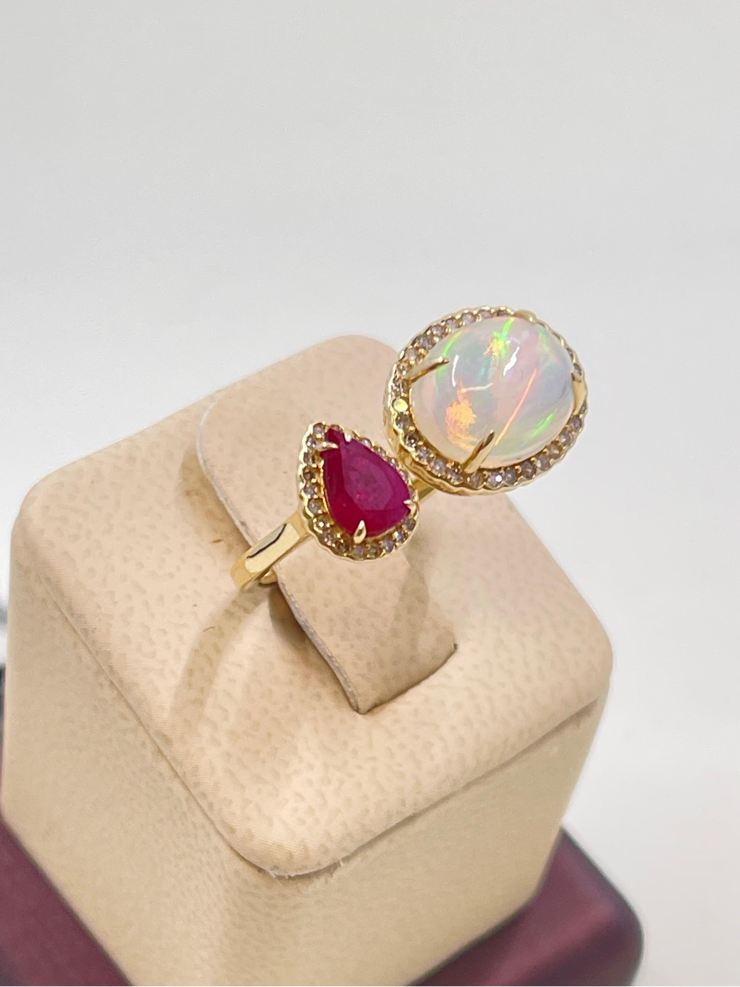 Breathtaking Fire Opal, Ruby & Diamond Ring In 14k yellow gold.

Opal 2.11 carats,

Ruby 0.68 carats,

Diamonds 0.246 carats

Gorgeous addition to your jewelry collection 💎