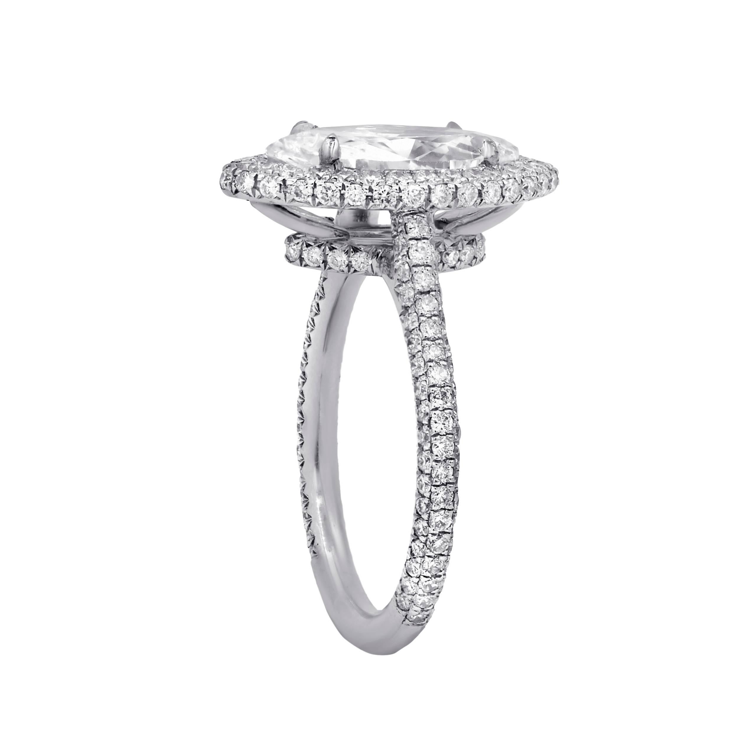 Elegant and custom designed  halo engagement ring in French pave set.The center GIA certified  marquise brilliant cut diamond features 2.00 cts D color/VS1 clarity and enhanced by sparkling  1.26 cts micro pave diamonds on the side in platinum