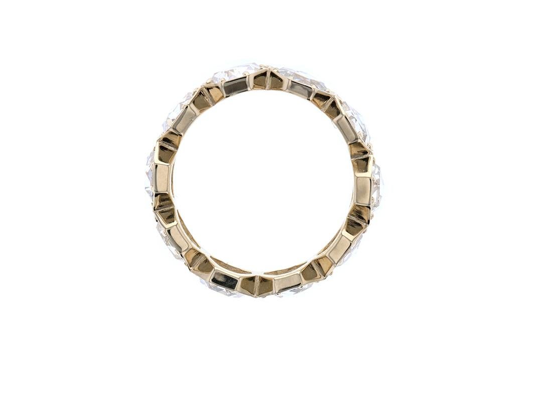 One of our all time favorite pieces! This is a stunning rose cut diamond eternity band made in 18k yellow gold and has 10 hexagon cut diamonds in a connected setting. Each diamond has 8 prongs keeping it securely in place. We love rose cut diamonds