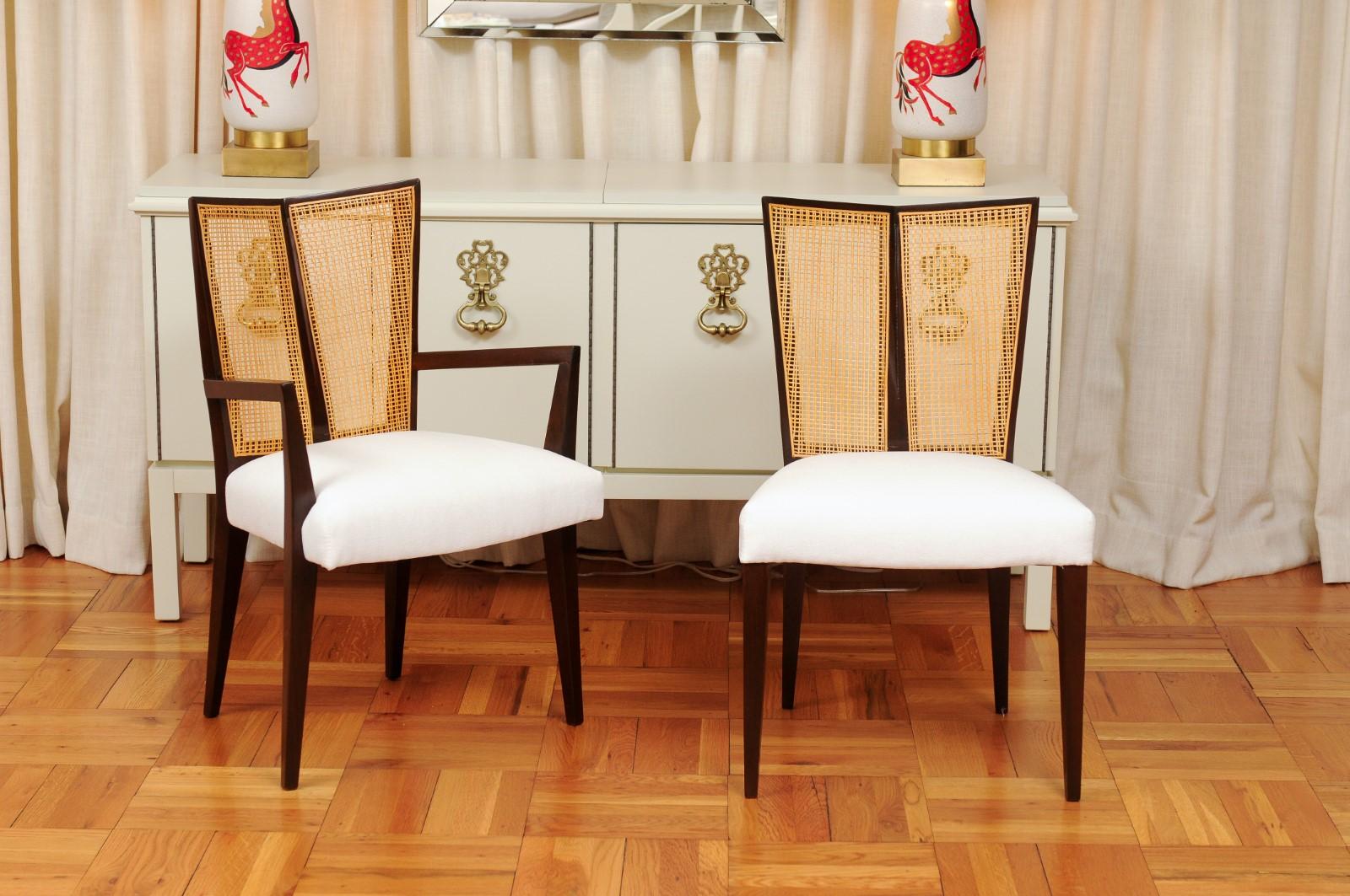 This magnificent unique set of dining chairs is shipped as professionally photographed and described in the listing narrative: Meticulously professionally restored, newly upholstered and completely installation ready. Expert custom upholstery