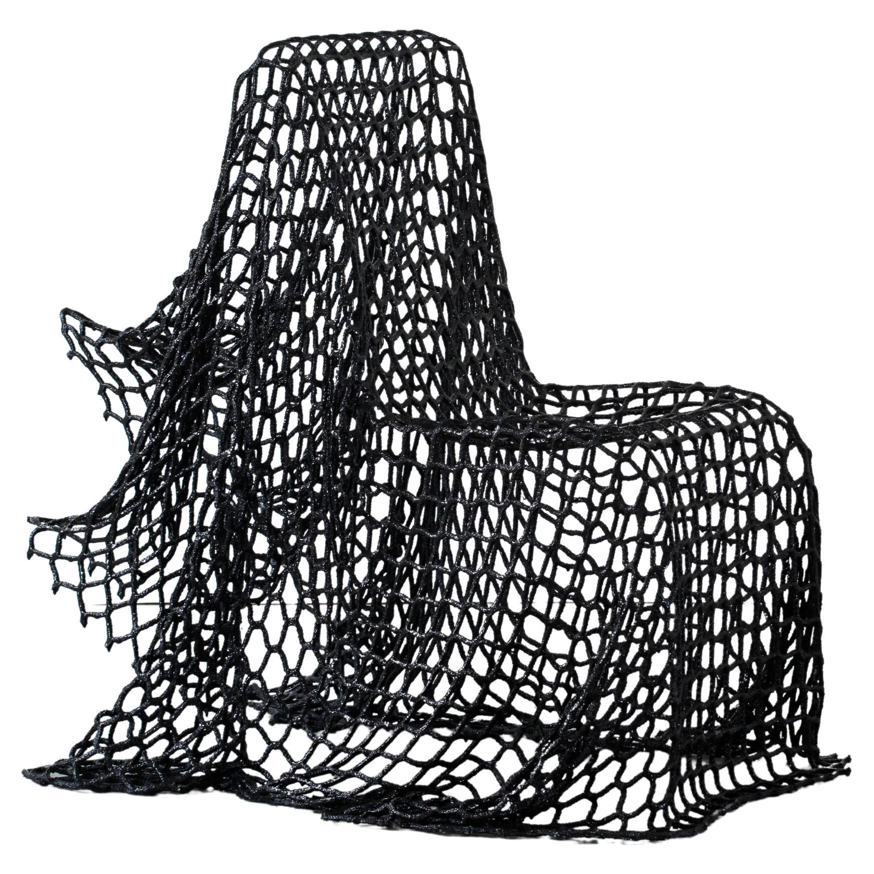 Lightweight chair made from reclaimed sports netting, hardened with epoxy resin For Sale