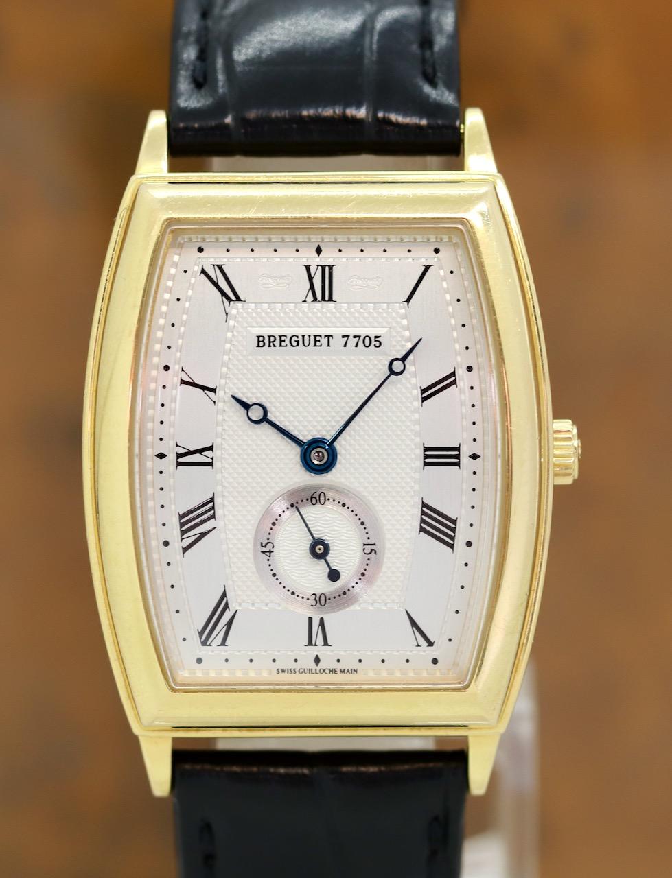With 18k gold Breguet buckle and original Box and Papers. 

The Breguet Héritage with the reference number 3670 is a masterpiece of traditional watchmaking art that immediately catches the eye with its tonneau shape and 18-carat gold case. The