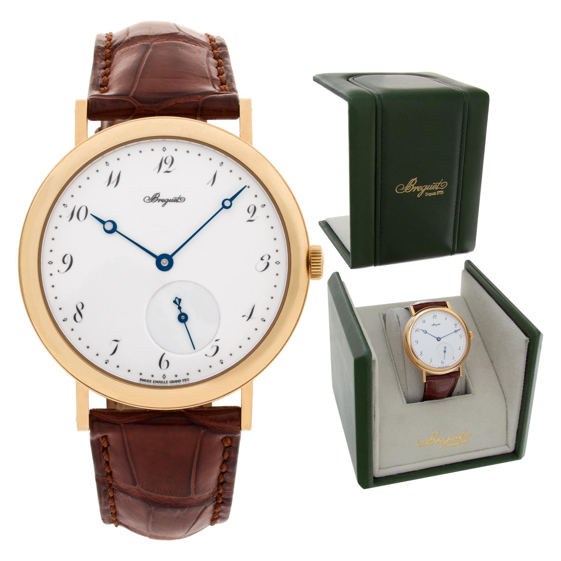 Breguet Classic in 18k on leather strap with 18k tang buckle. Auto w/ subseconds. 40 mm case size. With box. Ref 5140. Fine Pre-owned Breguet Watch.

Certified preowned Classic Breguet Classic 5140 watch is made out of yellow gold on a Brown Leather