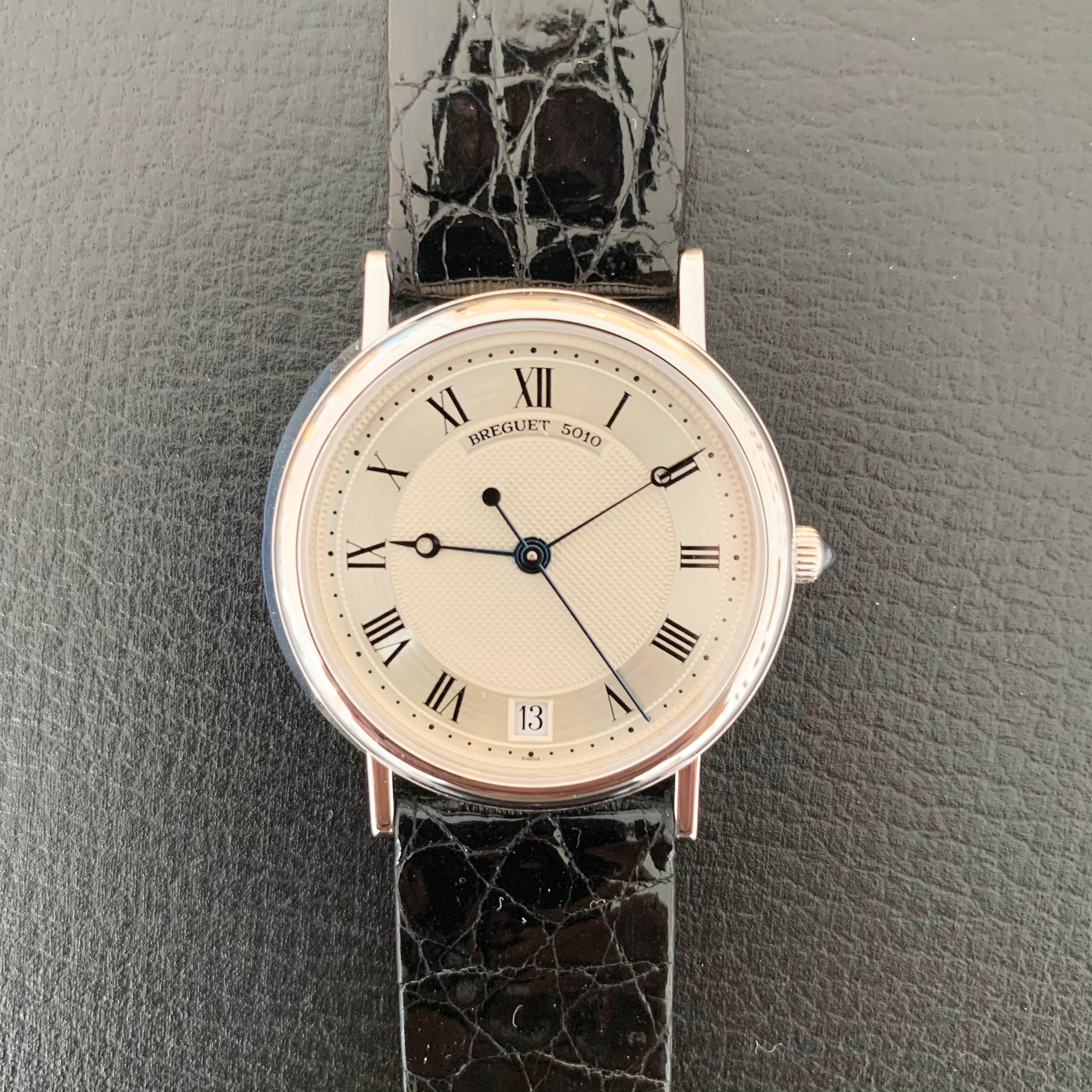 Breguet Classique reference number 3325. 18K white gold. Made in 1990. Original papers and watch tag and box. Excellent condition. Recently serviced. Sapphire glass. 33 mm case diameter. Silver dial. White gold clasp and buckle. Original crocodile