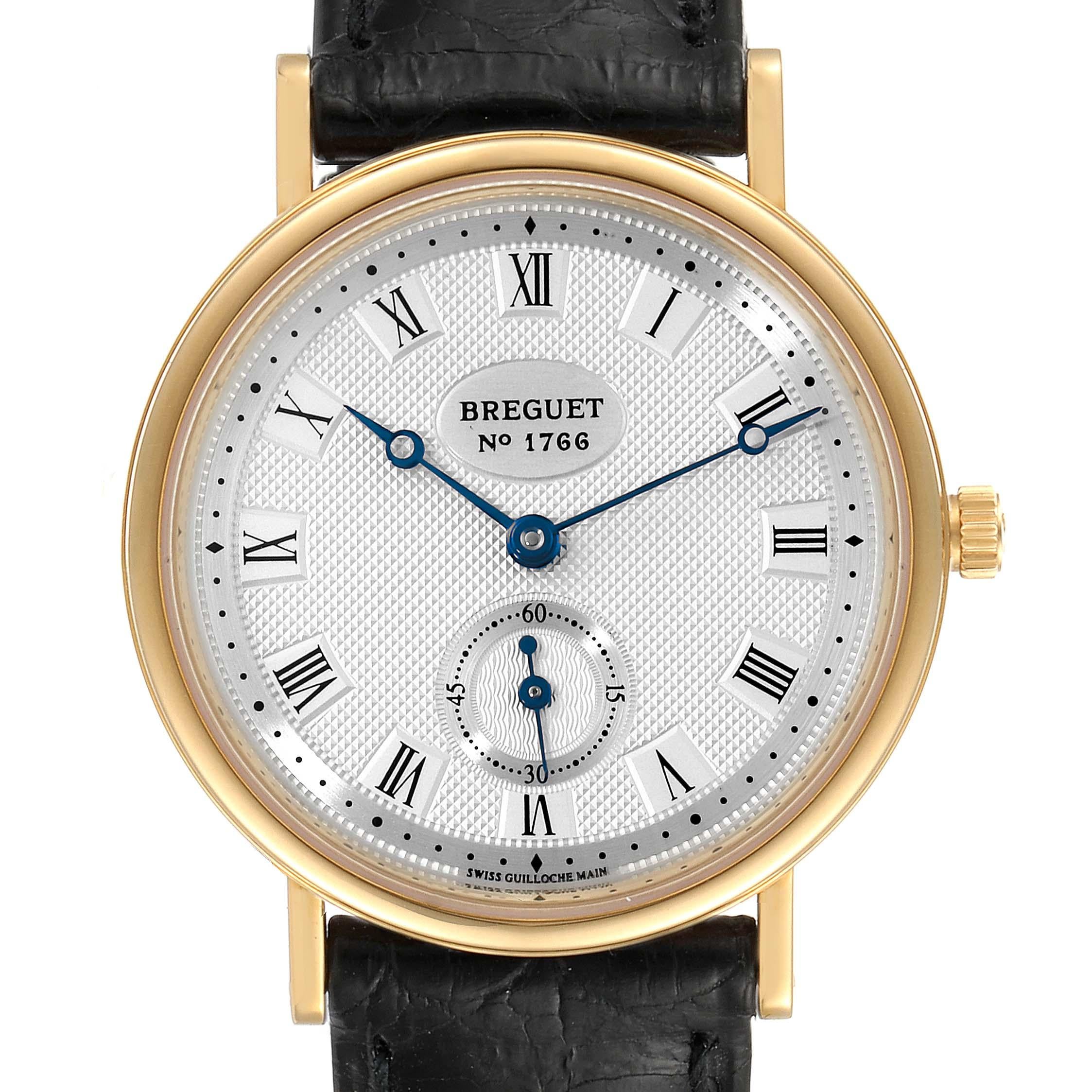 Breguet Classique 18K Yellow Gold Silver Dial Mens Watch 3910BA. Manual winding movement. Stainless steel coined edged case 34.0 mm in diameter. 18k yellow gold bezel. Scratch resistant sapphire crystal. Hand engraved silvered dial with roman