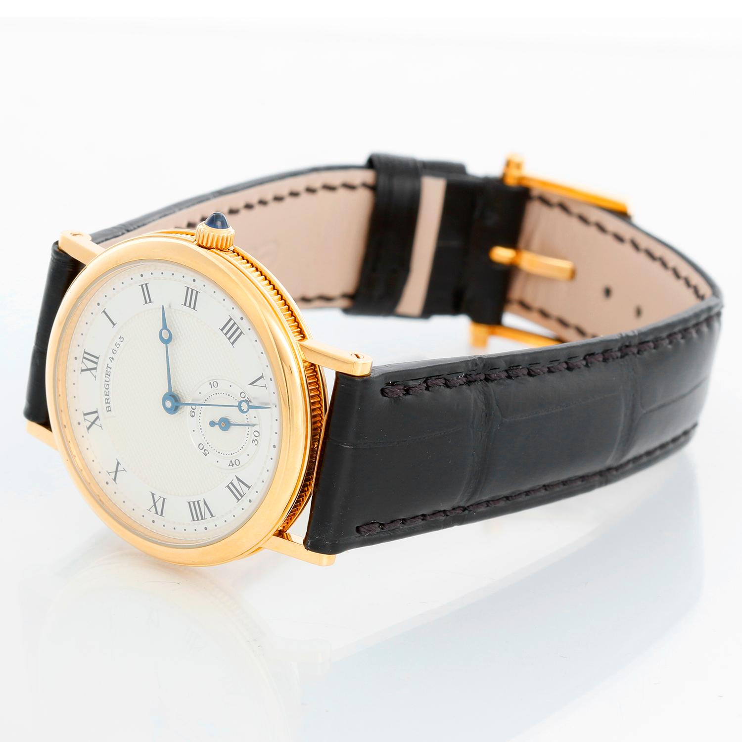 Breguet Classique 18k Yellow Gold Watch Ref 3290/2 - Manual winding. 18k yellow gold case ( 33 mm ). Two-tone silvered black Roman numerals, guilloche center. Brand new black leather Breguet  band with 18K Yellow gold tang buckle. Pre-owned with
