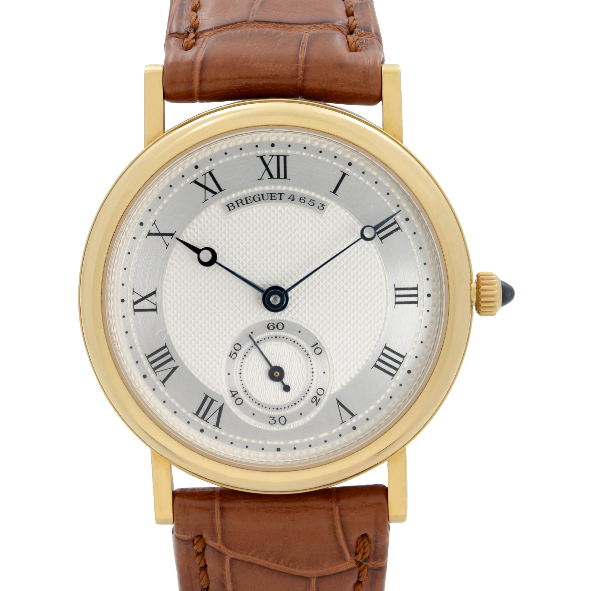 Pre-Owned Breguet Classique 32 mm 18k Yellow Gold Silver Dial Men's Hand-wind Watch 3290. The Watch is powered by an Automatic Movement and Features: Polished 18k Yellow Gold Round Case and Two-Piece Leather Strap. Fixed Gold Bezel. Silver Guilloche
