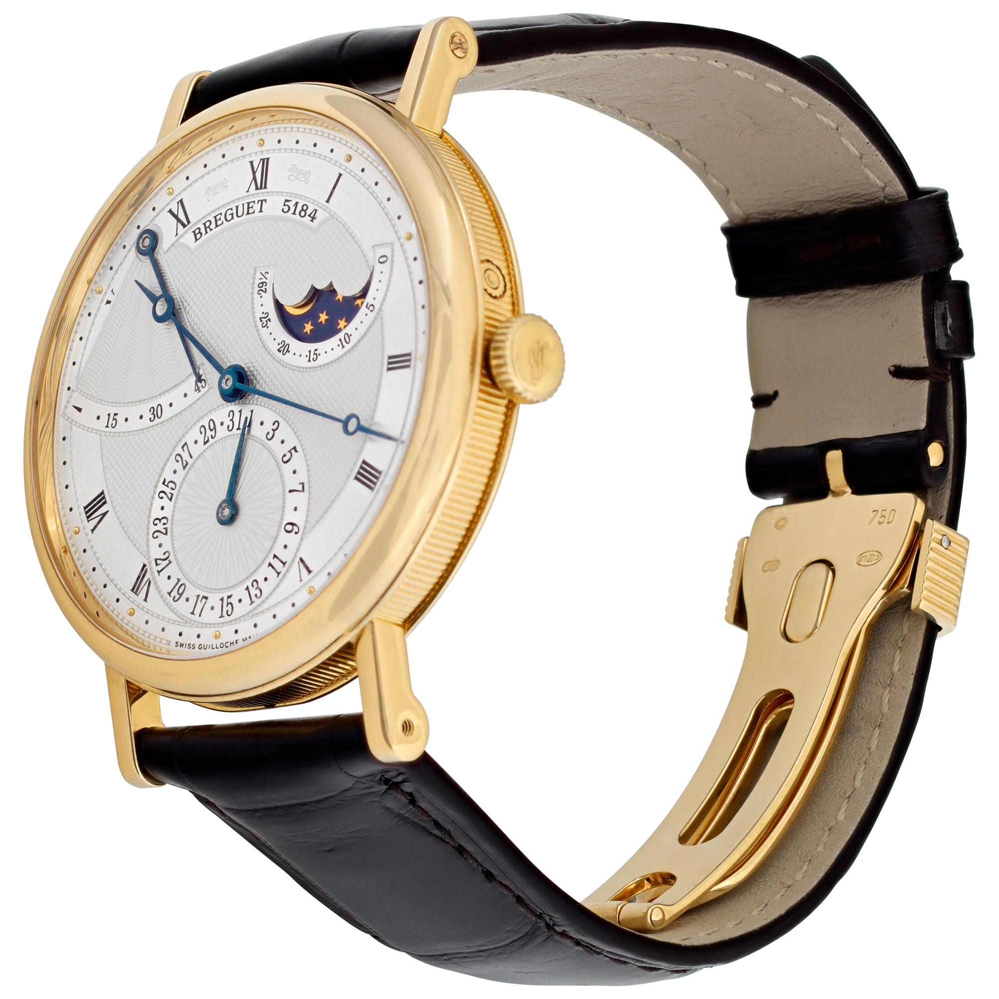 Breguet Classique in 18k yellow gold on a dark brown strap with an 18k yellow gold Breguet deployant buckle. Automatic movement under glass w/ subseconds, moonphase and power reserve. 39 mm case size. Ref 7137. Fine Pre-owned Breguet Watch.

