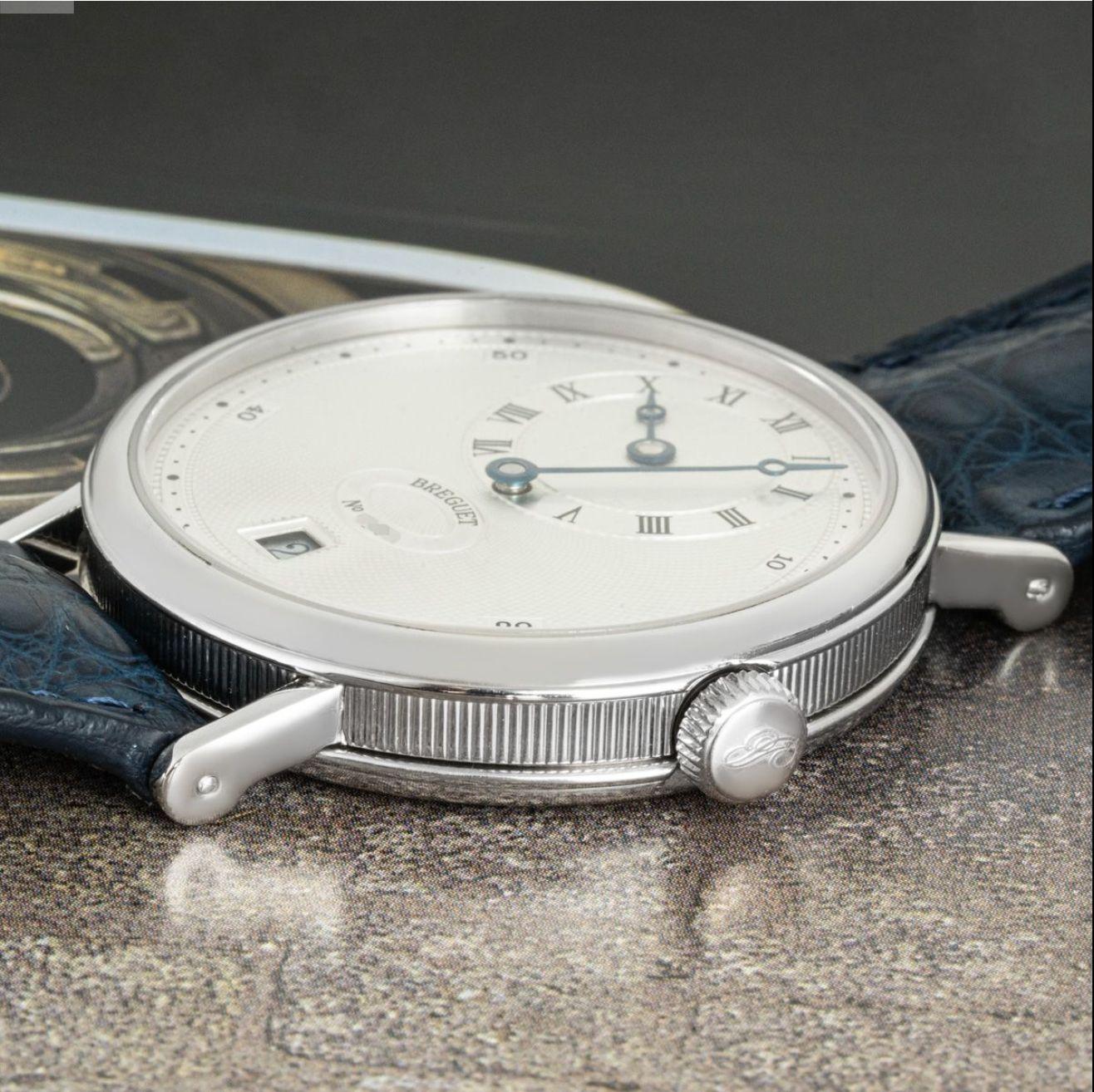 A platinum crafted Classique by Breguet. Featuring a silver guilloche dial with an off-centre dial with roman numerals indicating the hour. The watch also features a date aperture, blued steeled hands and a platinum bezel.

Fitted with a sapphire