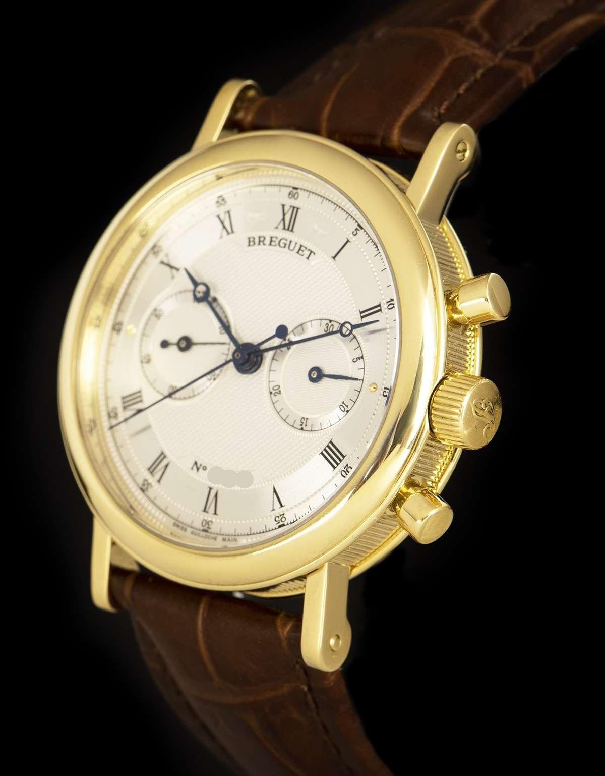 An 18k Yellow Gold Classique Gents 37mm Wristwatch, silvered guilloche dial hand engraved on a rose engine with roman numerals, 30 minute recorder at 3 0'clock, small seconds at 9 0'clock, a fixed 18k yellow gold bezel, a brown leather strap (not by