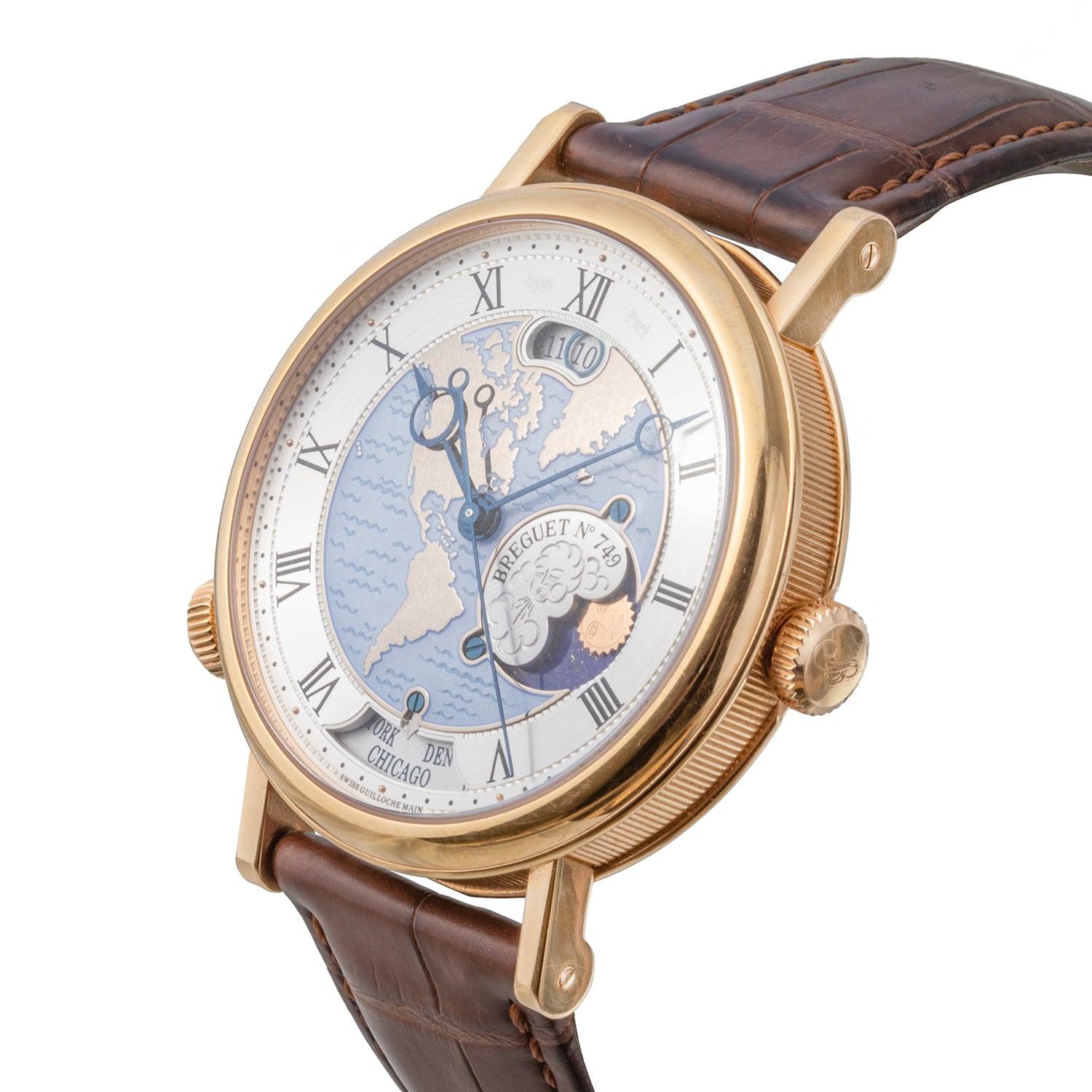 Pre-owned Breguet Classique Hora Mundi wristwatch (ref. 5717BR/EU/9ZU), featuring a self-winding automatic movement; gold dial depicting the American continent, hand-engraved on a rose engine with a light blue 'wave' motif at center coated with