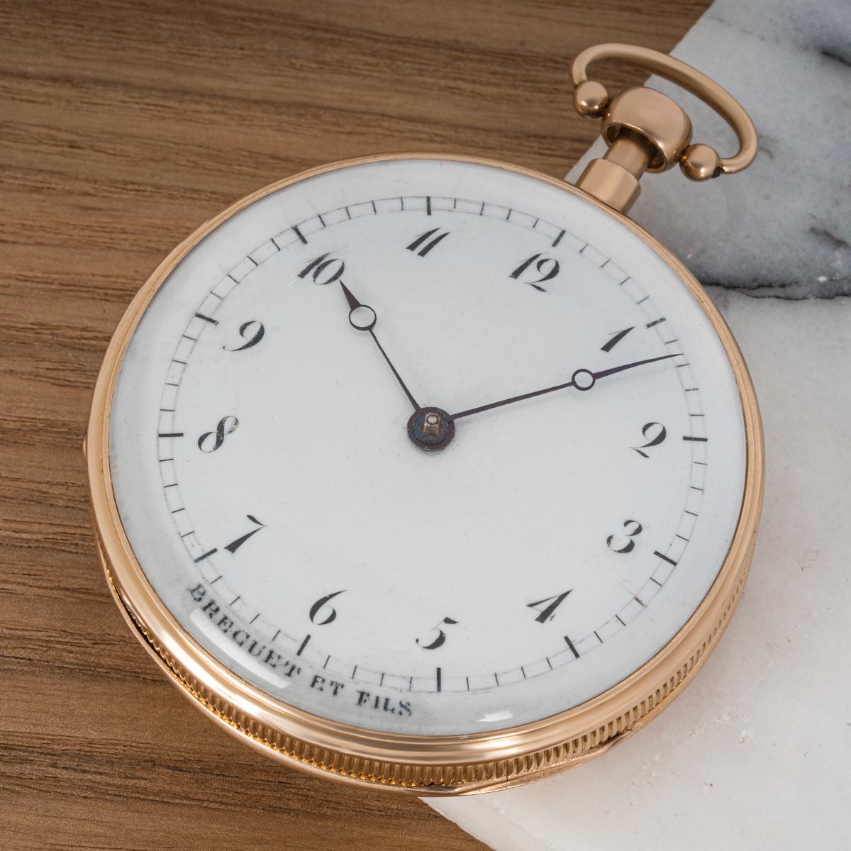 Breguet et Fils. A Rare 18kt Rose Gold Open Faced Keywind Cylinder Musical Quarter Repeater Pocket Watch C1830s.

Dial: The white enamel dial signed Breguet et Fils with Breguet numerals outer minute track with blued Steel Breguet style moon