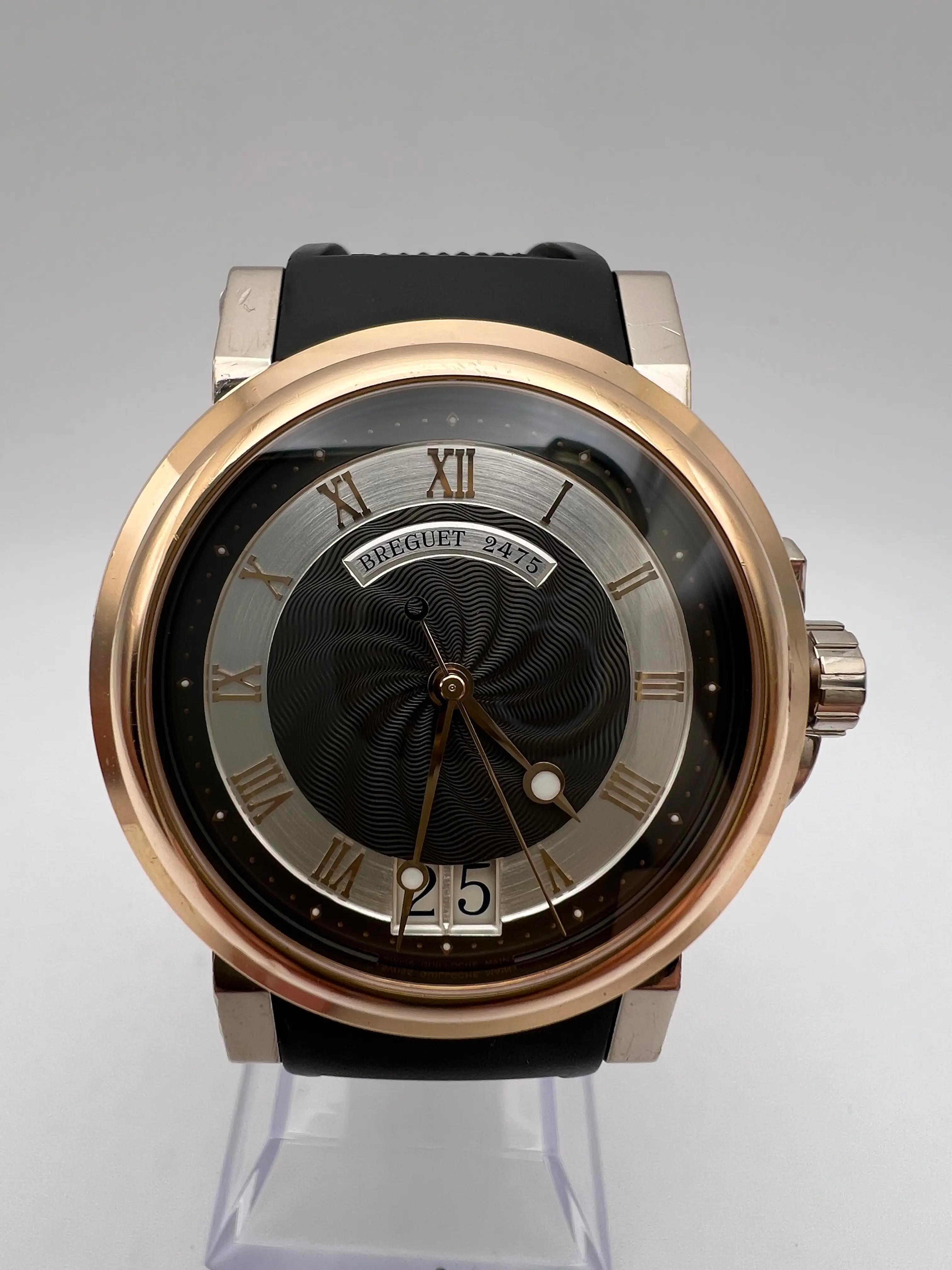 Breguet Marine Big Date, reference 5817BE/Z2/5V8, a timepiece that blends classic elegance with contemporary design. This watch features a 39mm Two Tone 18K Rose Gold case, exhibition caseback and 18K white gold lugs. The striking black and silver