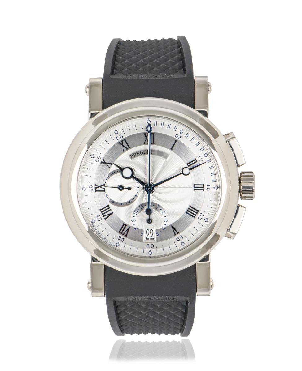A men's 42mm Marine wristwatch crafted in white gold by Breguet. Featuring a distinctive silver dial with roman applied numerals, blued steeled Breguet hands, a 12 hour and a small seconds sub dial with a date aperture. Complementing the dial is a