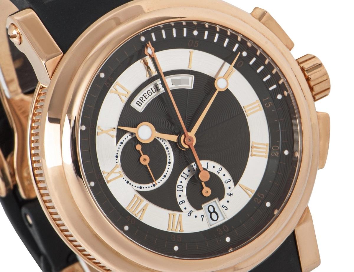 A men's 42mm Marine wristwatch crafted in Rose gold by Breguet. Featuring a distinctive silver dial with roman applied numerals, blued steeled Breguet hands, a 12 hour and a small seconds sub dial with a date aperture. Complementing the dial is a