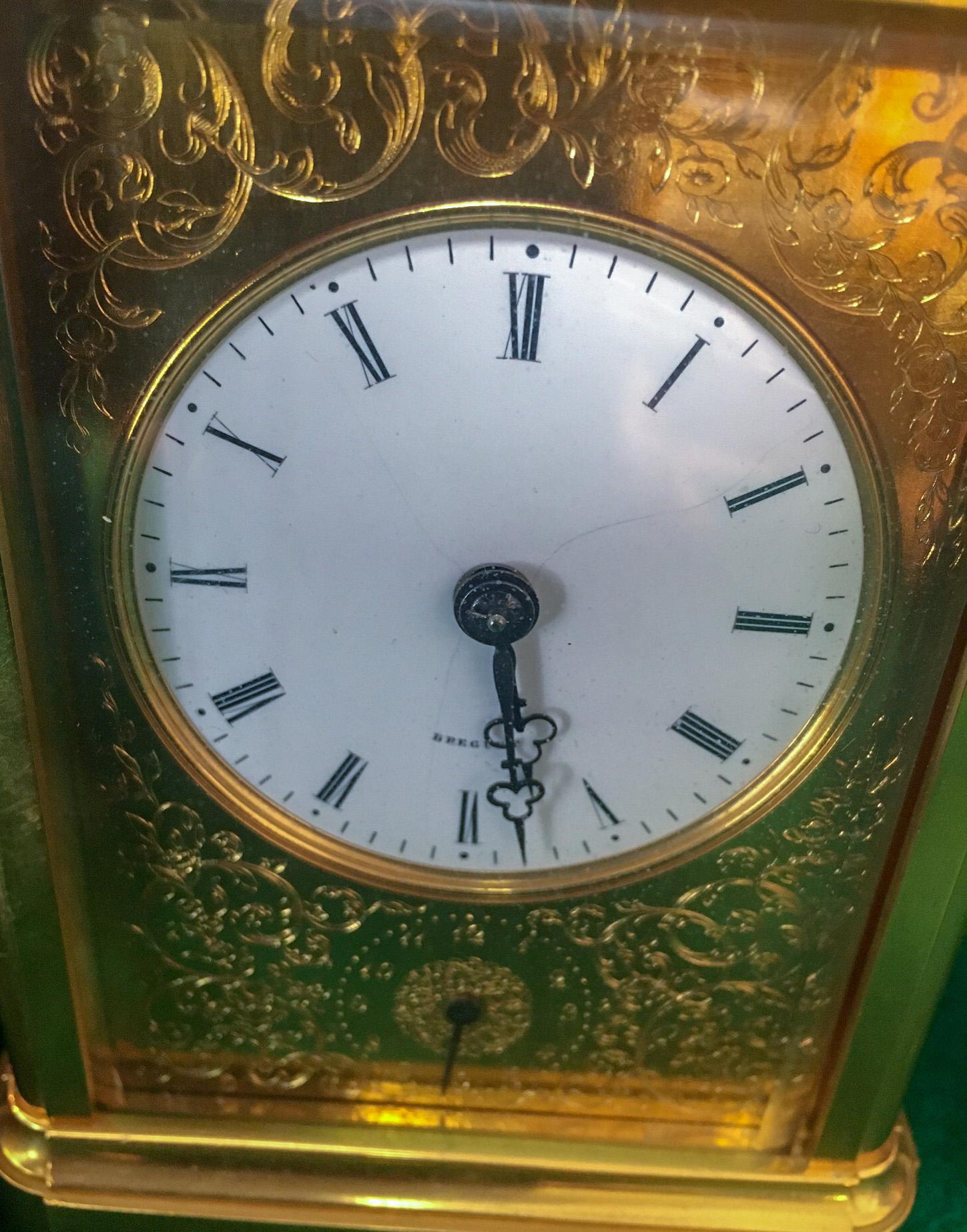 This incredible French grande and petite sonnerie striking carriage clock
by Breguet Neveu Compagnie à Paris, features:
Case: the gilded brass case with rectangular top and
folding handle over an oval beveled glass escapement
aperture and push