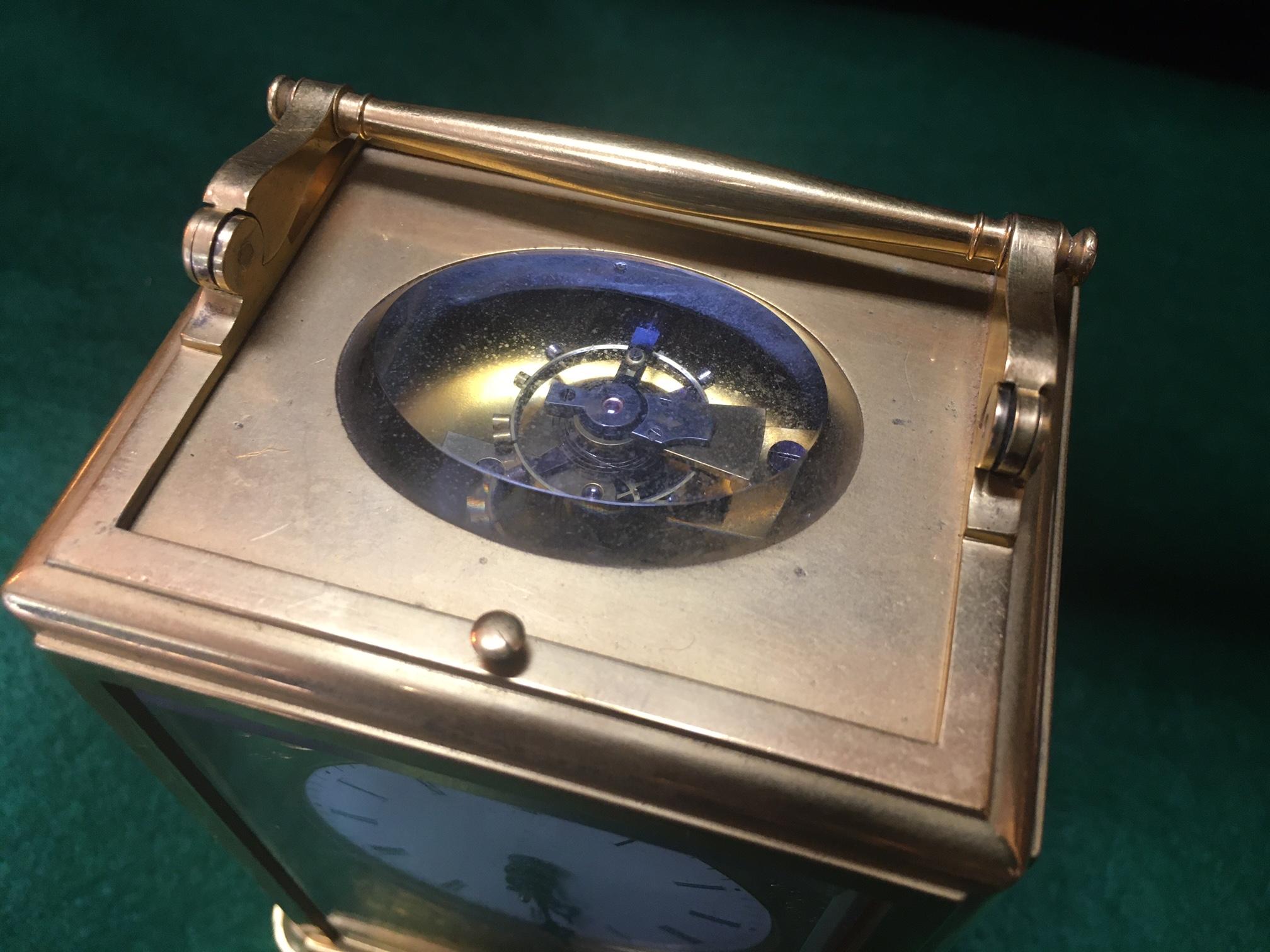 This incredible French grande and petite sonnerie striking carriage clock
by Breguet Neveu Compagnie à Paris, features:
Case: the gilded brass case with rectangular top and
folding handle over an oval beveled glass escapement
aperture and push