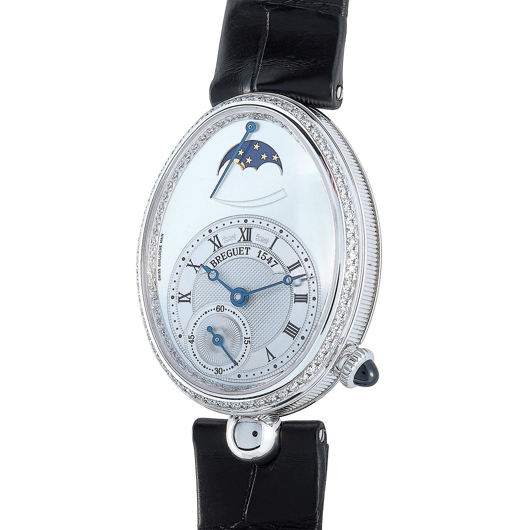 The Breguet Reine de Naples 8908 watch, reference number 8908BB/52/964 D00D, is created for the sublime “Reine de Naples” collection.

This timepiece is presented with an 18K white gold case that boasts diamond-set bezel. The case is mounted onto a