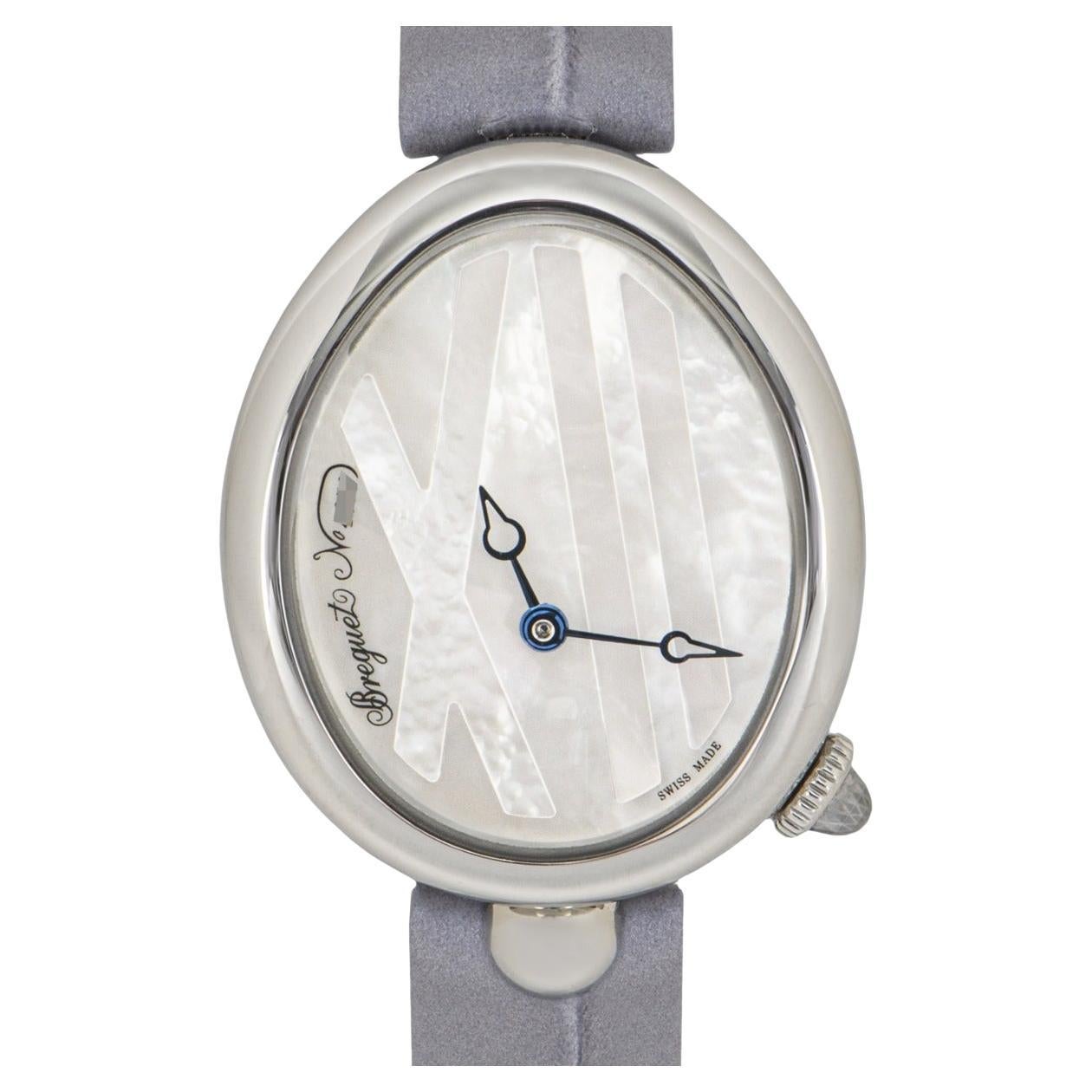 A ladies 27mm Reine De Naples crafted in stainless steel by Breguet. Featuring a distinctive mother of pearl dial with blued steel hands. Complementing the dial is a fixed smooth stainless steel bezel with a coin edge finish that is synonymous with