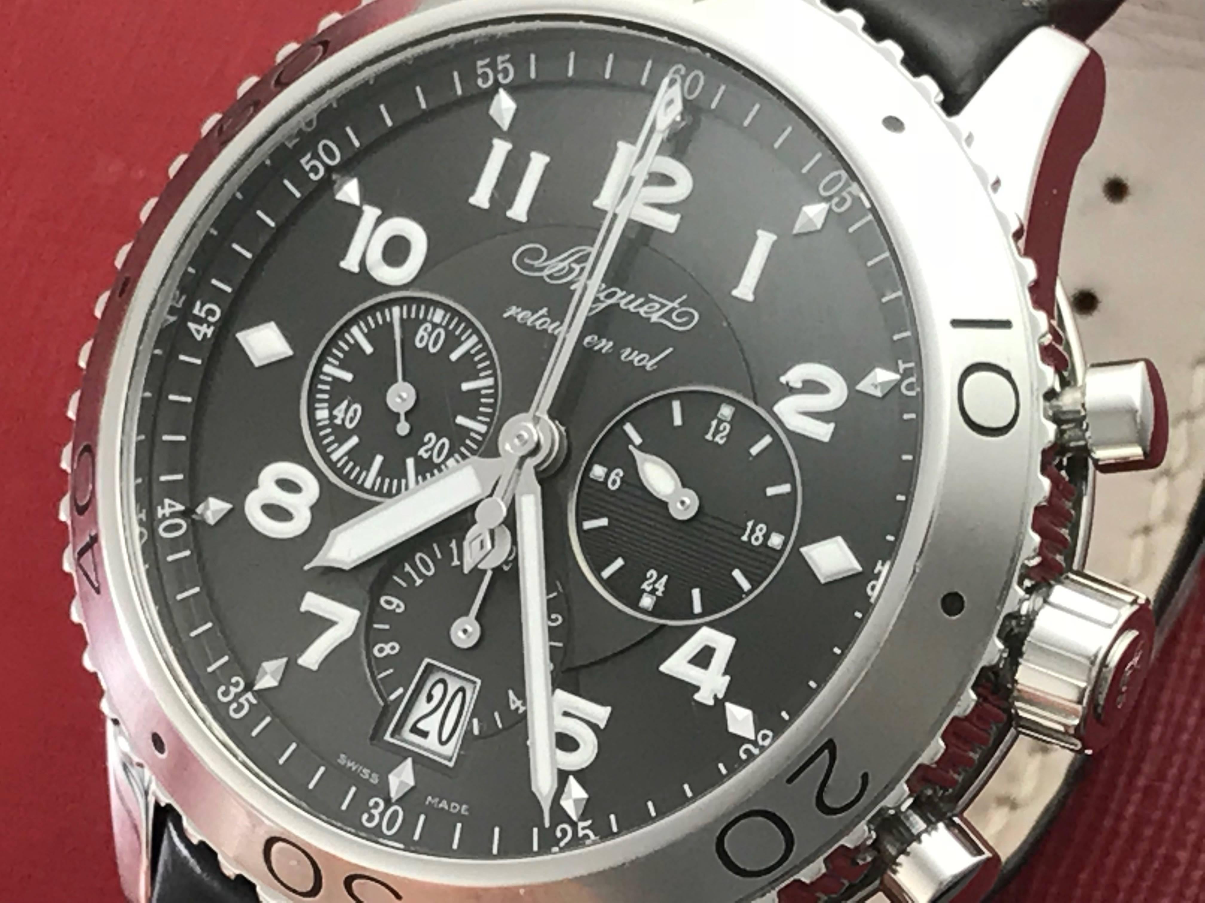 Breguet Type XXI Flyback Chronograph Model 3810ST/92/9ZU certified pre-owned men's automatic wrist watch.  Featuring a charcoal dial with luminous arabic numerals encased in stainless steel, with a screw down crown and measuring 42mm. Dark chocolate