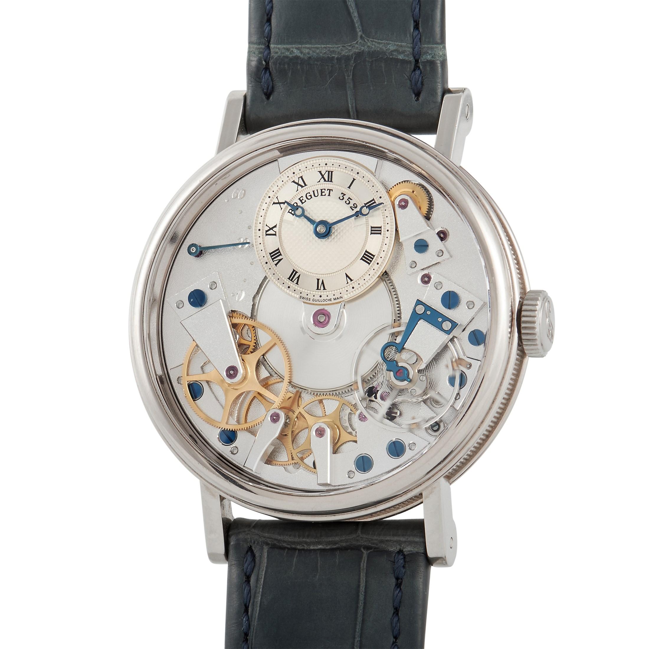 A timeless watch you'll love as much a decade from now as you do today. This piece from Breguet has the actual dial staged at 12 o'clock displaying an impressive hand-engraved silver Guilloche. The rest of the dial displays the inner movement of the