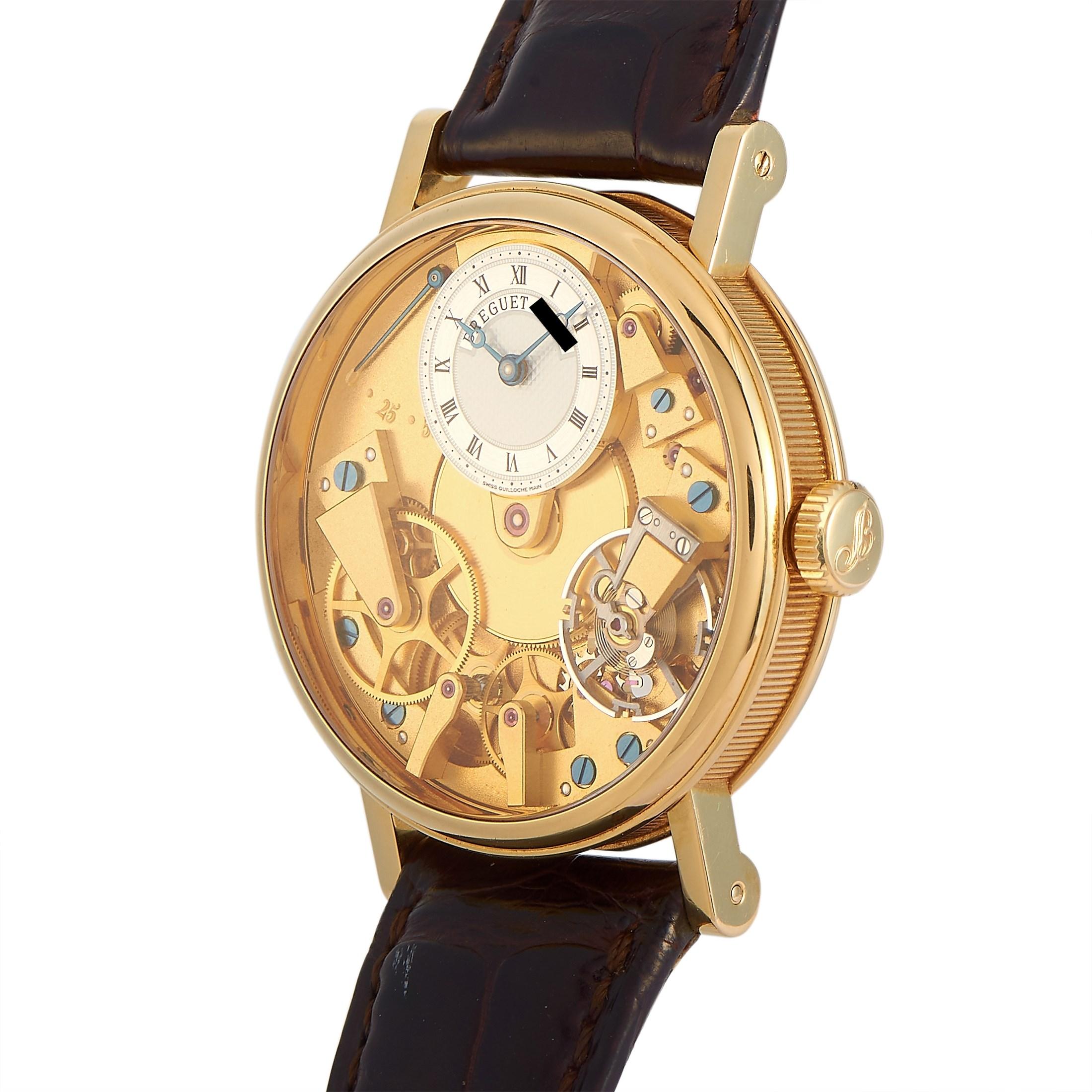 The Breguet Tradition Watch, reference number 7027, will captivate anyone who appreciates technical details and exceptional craftsmanship. 

This watch features a sleek, sophisticated 37mm round case made from 18K Yellow Gold. Opulent gold detailing