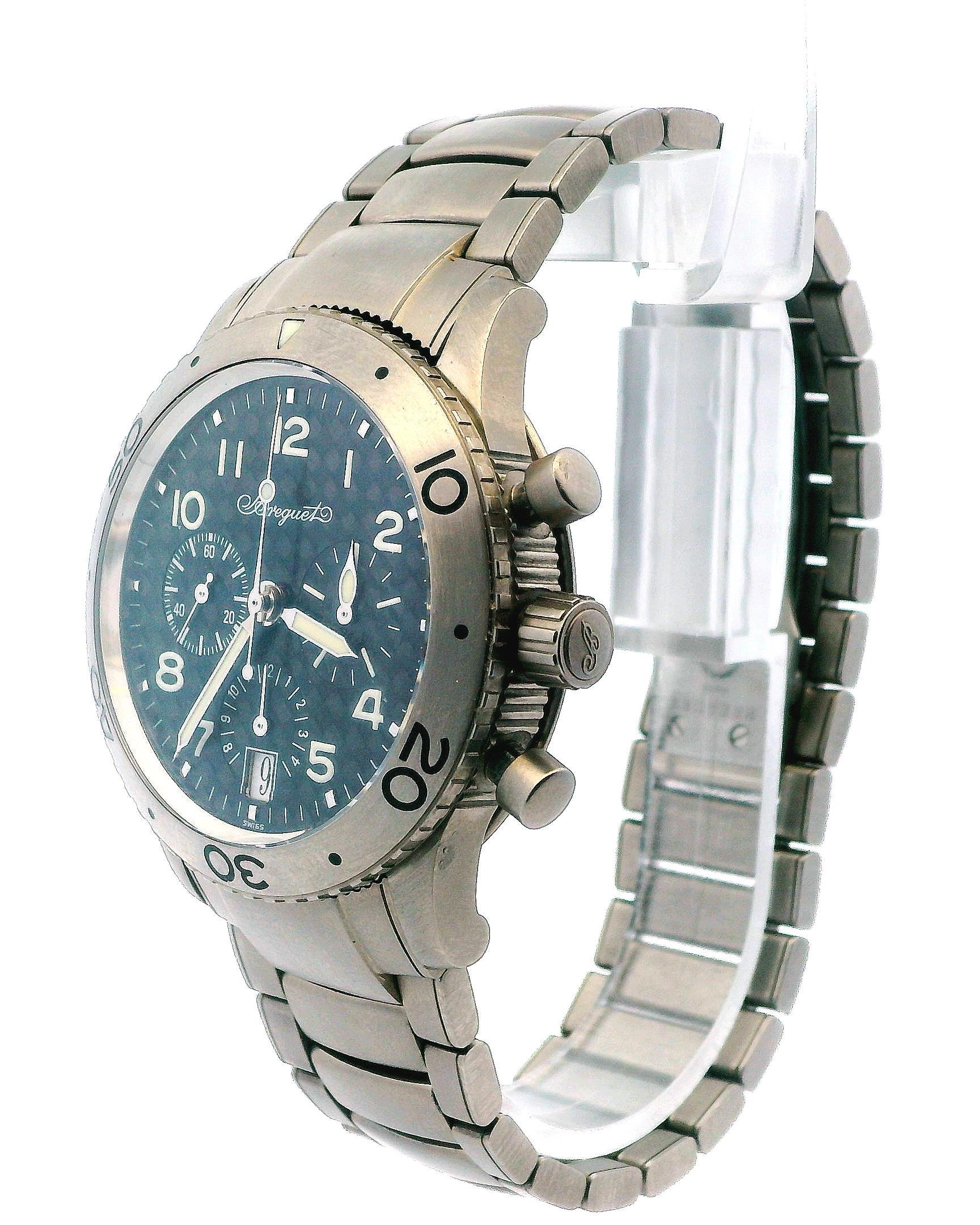The Breguet Type XX 3820 features a 39mm titanium case with a bidirectional titanium bezel. It has a carbon dial complemented by luminescent silver-tone hands and Arabic numeral hour markers. The watch includes three sub-dials: a small seconds hand