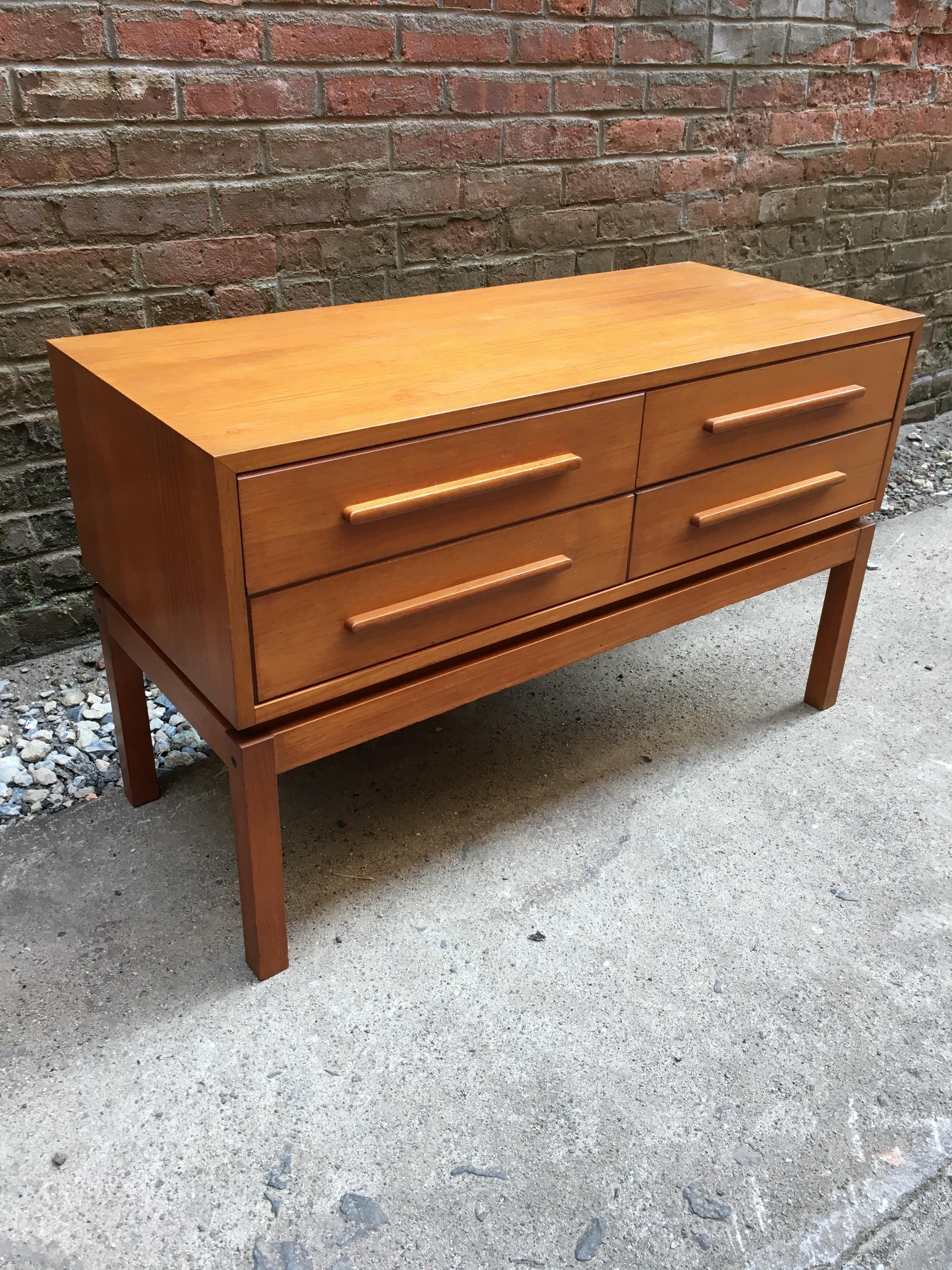 Teak construction four drawer low dresser or console. Solid teak legs. Attributed to Breistein Mobelfabrikk, Norway. Very clean and room ready. Unsigned.