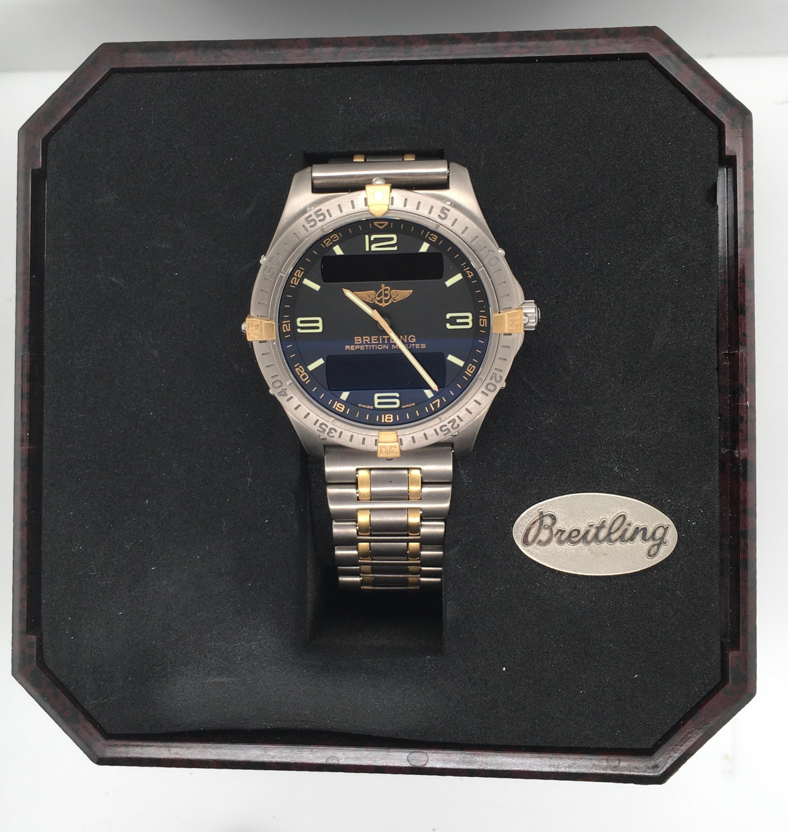 A striking Breitling Aerospace Repetition Minutes chronograph with titanium case, 18kt bezel and Arabic numerals on a black dial. This never-worn 100 meter water resistant model features a matching silver-colored titanium bracelet, steel clasp and a