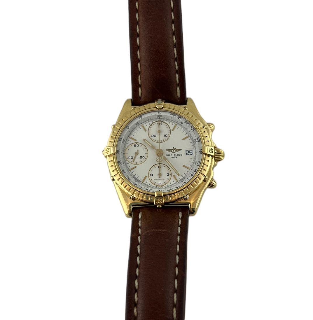 Breitling Chronomat 18K Yellow Gold Men's Watch

Model: K13047X
Serial: 13983

This men's Breitling Chronomat watch is set in 18K yellow gold

Case is 39mm in diameter

White dial with gold details. Date at 3

Brown Breitling leather band with 18K