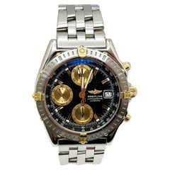 Breitling Chronomat B13352 Schwarzes Zifferblatt 18K Gelbgold Edelstahl Box Papier