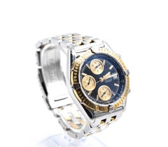Montre chronographe Breitling Chronomat en or jaune 18 carats et acier inoxydable
