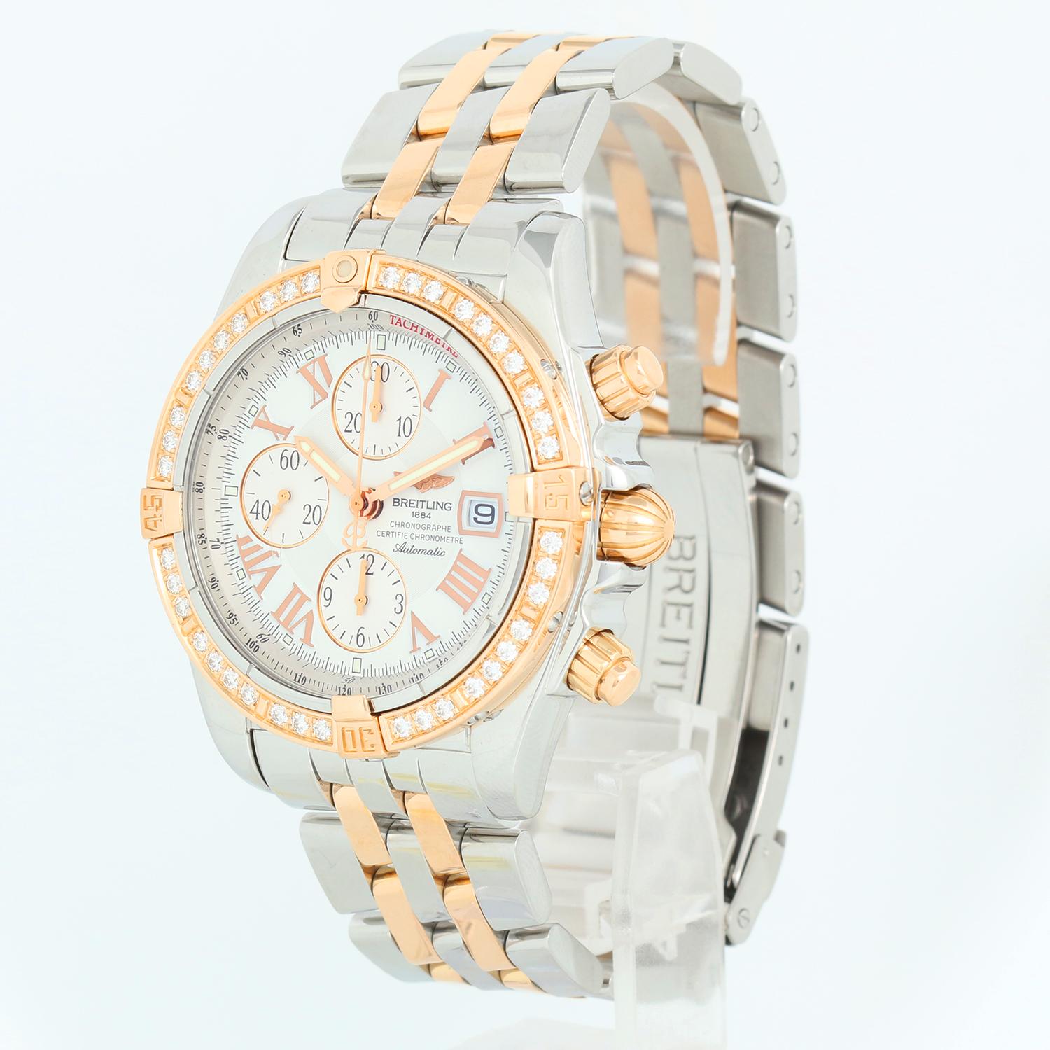 Breitling Chronomat Evolution 2-Tone Diamond Watch C13356 - Automatic winding. Stainless steel & 18k rose gold; diamond bezel weighing 1.14 cts. (45 mm ). White dial with Roman numerals; subdials. Stainless steel & 18k rose gold; fits up to a 8 inch
