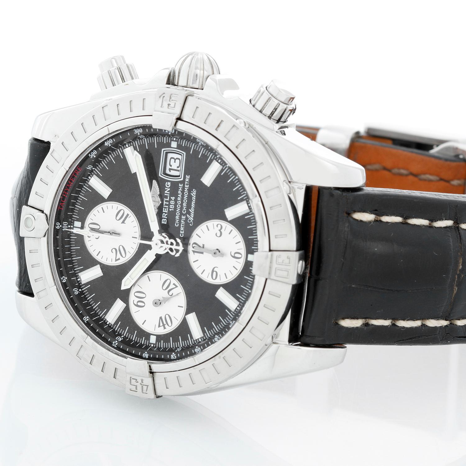 Breitling Chronomat Evolution Men's Watch A1335611 - Automatic winding chronograph. Stainless steel case with steel bezel (42 mm). Black dial with polished hour markers. Black alligator with Breitling deployant clasp. Pre-owned with Breitling box