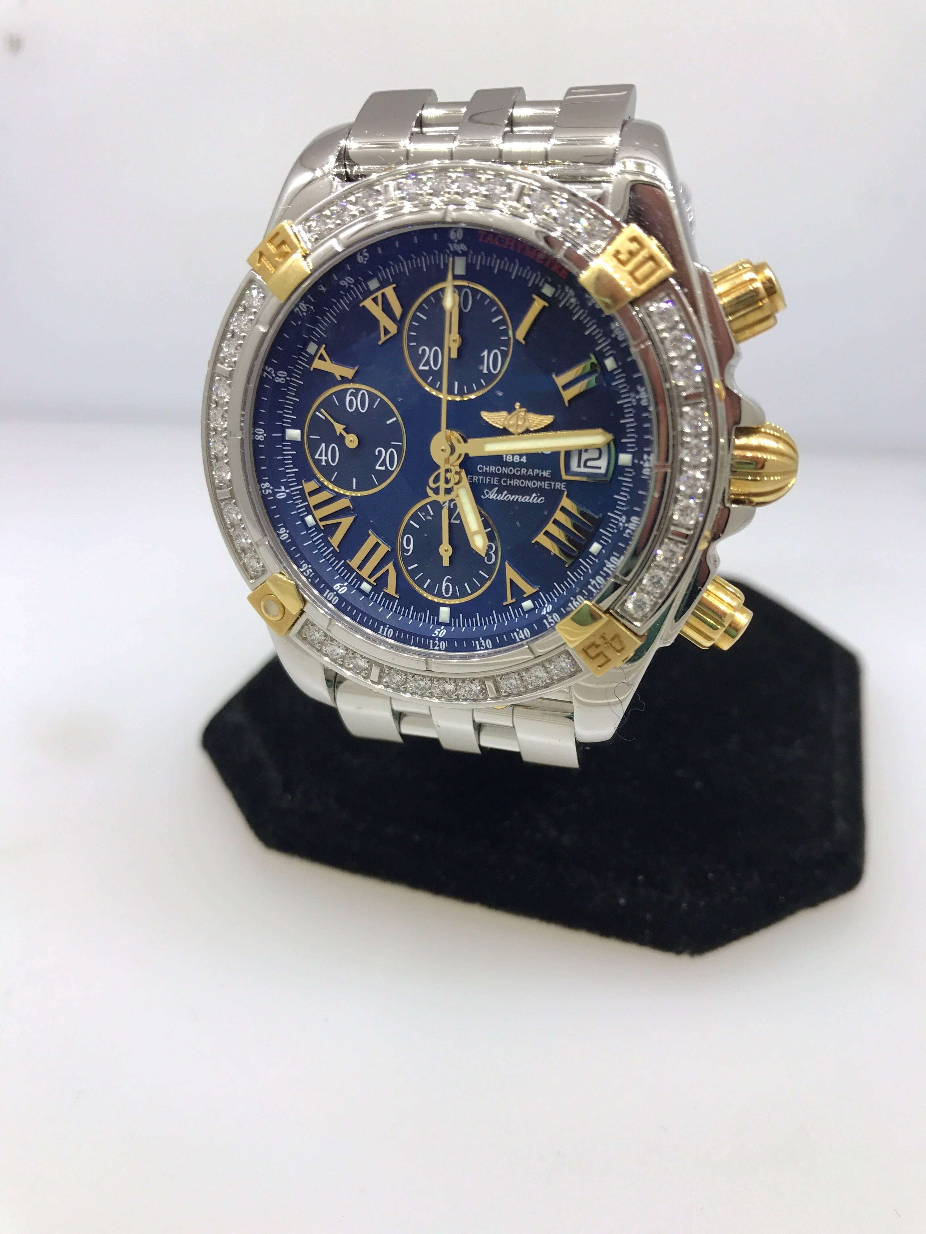 Breitling Chronomat Evolution Two Tone Men's Watch

Model Number: B1335653

100% Authentic

Brand New

Comes with original Breitling box, warranty, and instruction manual

Stainless Steel and 18 Karat Yellow Gold Case

40 Diamonds on the Bezel

Blue