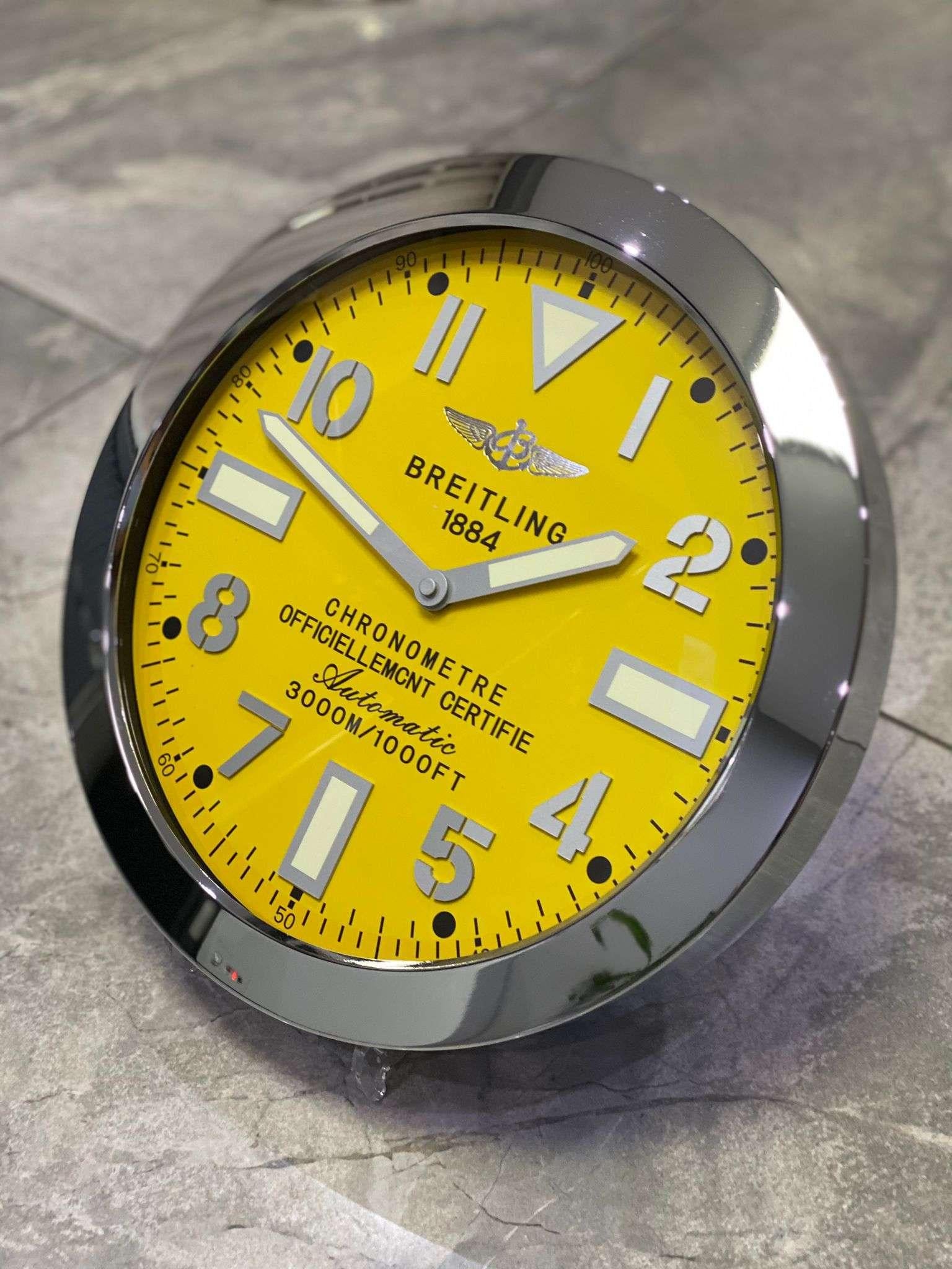 Breitling Chronometer Luxury Fluted Bezel Luminous Wall Clock
Luxurious stainless steel case, wall clock based on the BREITLING in silver steel with the iconic fluted bezel.
Choice of Markers with or without lume strips Sweeping Quartz movement