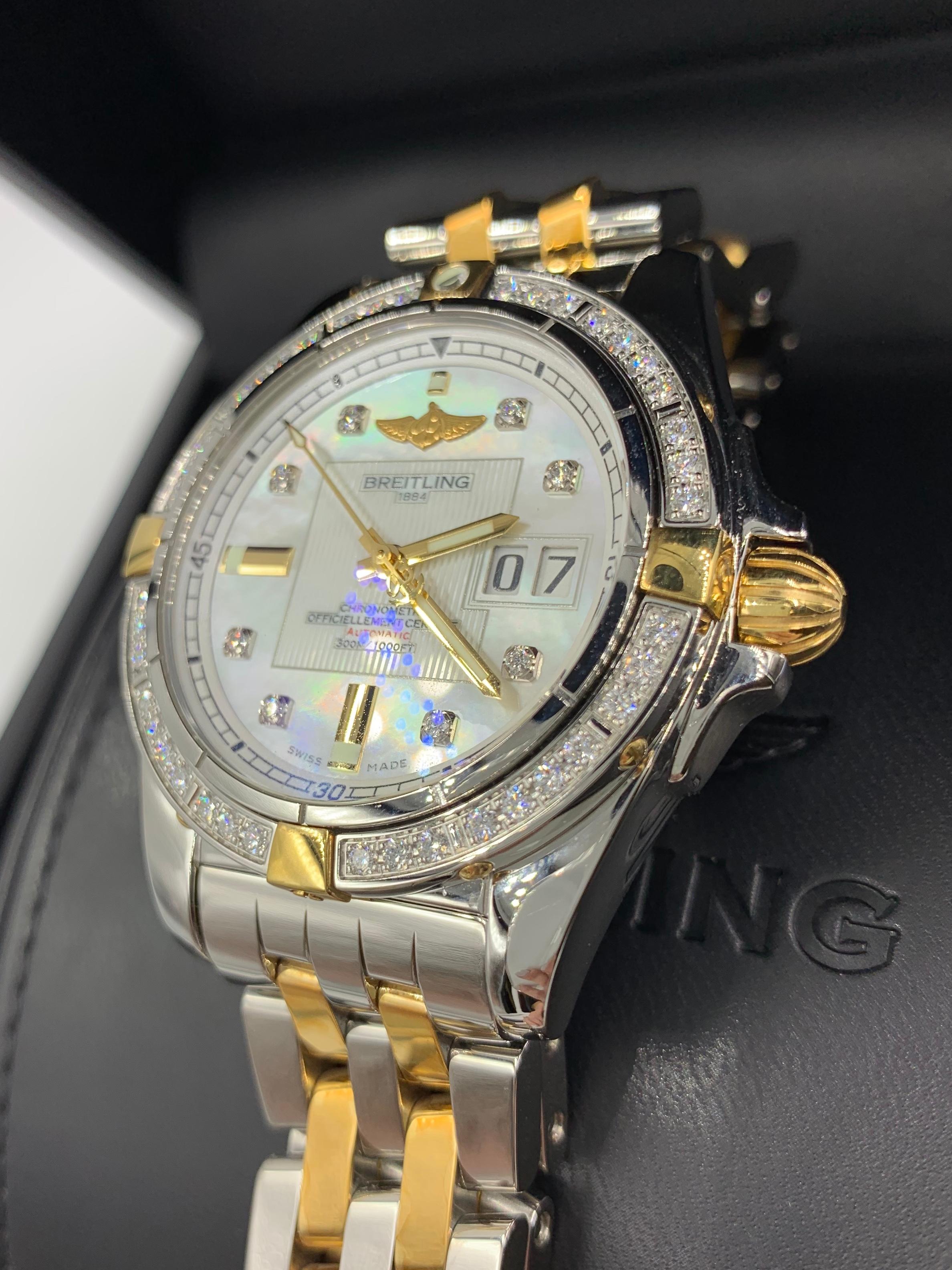 Breitling Cockpit Galactic automatic 41mm made with 18 Karat gold and stainless steel diamond timepiece Model: B49350LA. This Breitling timepiece features a mother of pearl dial, diamond hour marks with a large date window at the 3 o'clock and an
