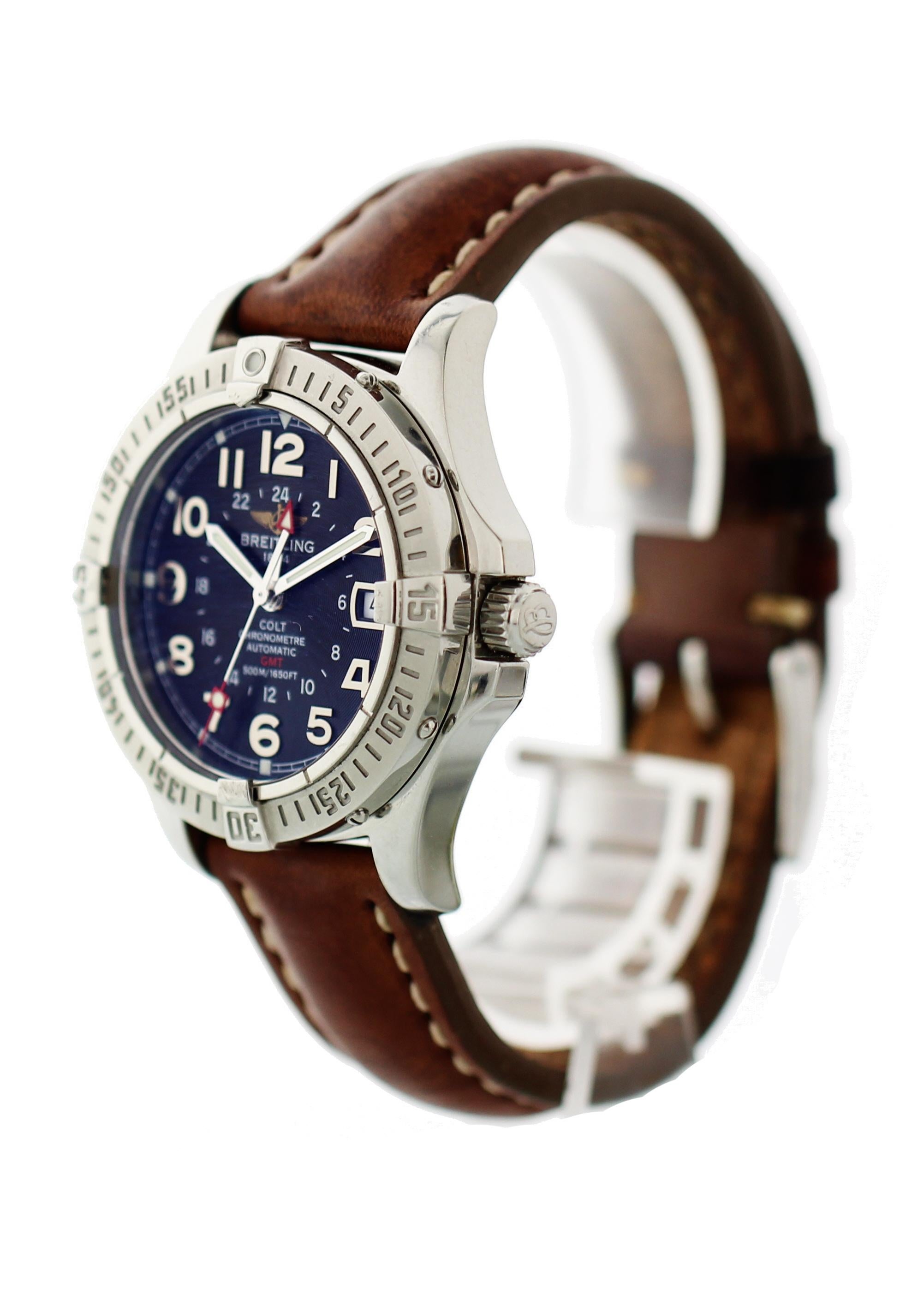 Breitling Colt GMT A32350. Stainless Steel 40mm case with unidirectional rotating bezel. Blue dial with silver luminous hands and hour markers. Date Display at 3 O'clock. Brown leather strap with a steel buckle. Sapphire crystal glass. Automatic