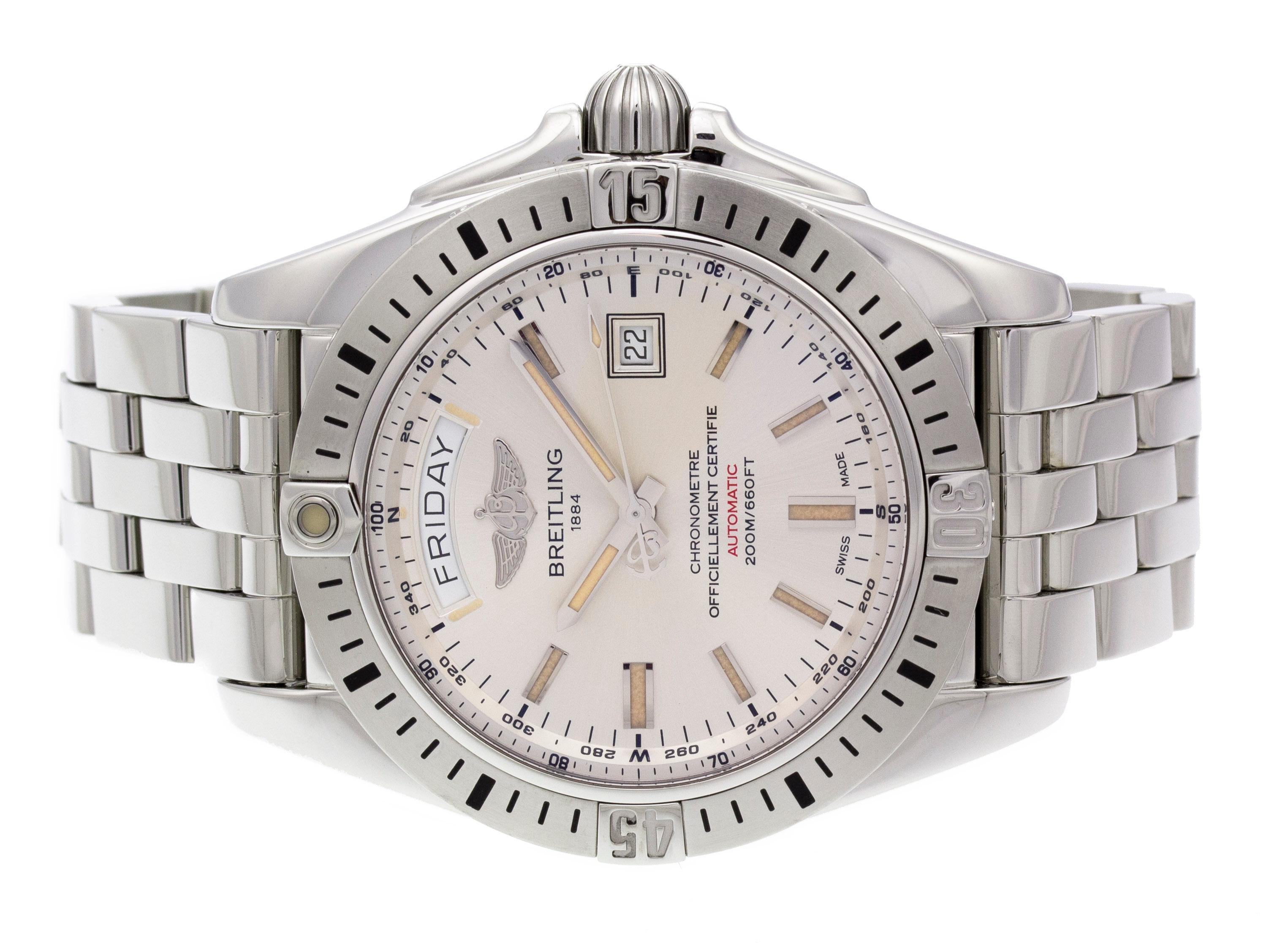 Stainless steel Breitling Galactic 44 Day Date automatic watch with a 44mm case, silver dial, and bracelet with deployment buckle. Features include hours, minutes, seconds, day, and date. Comes with Gift Box and 2 Year Store