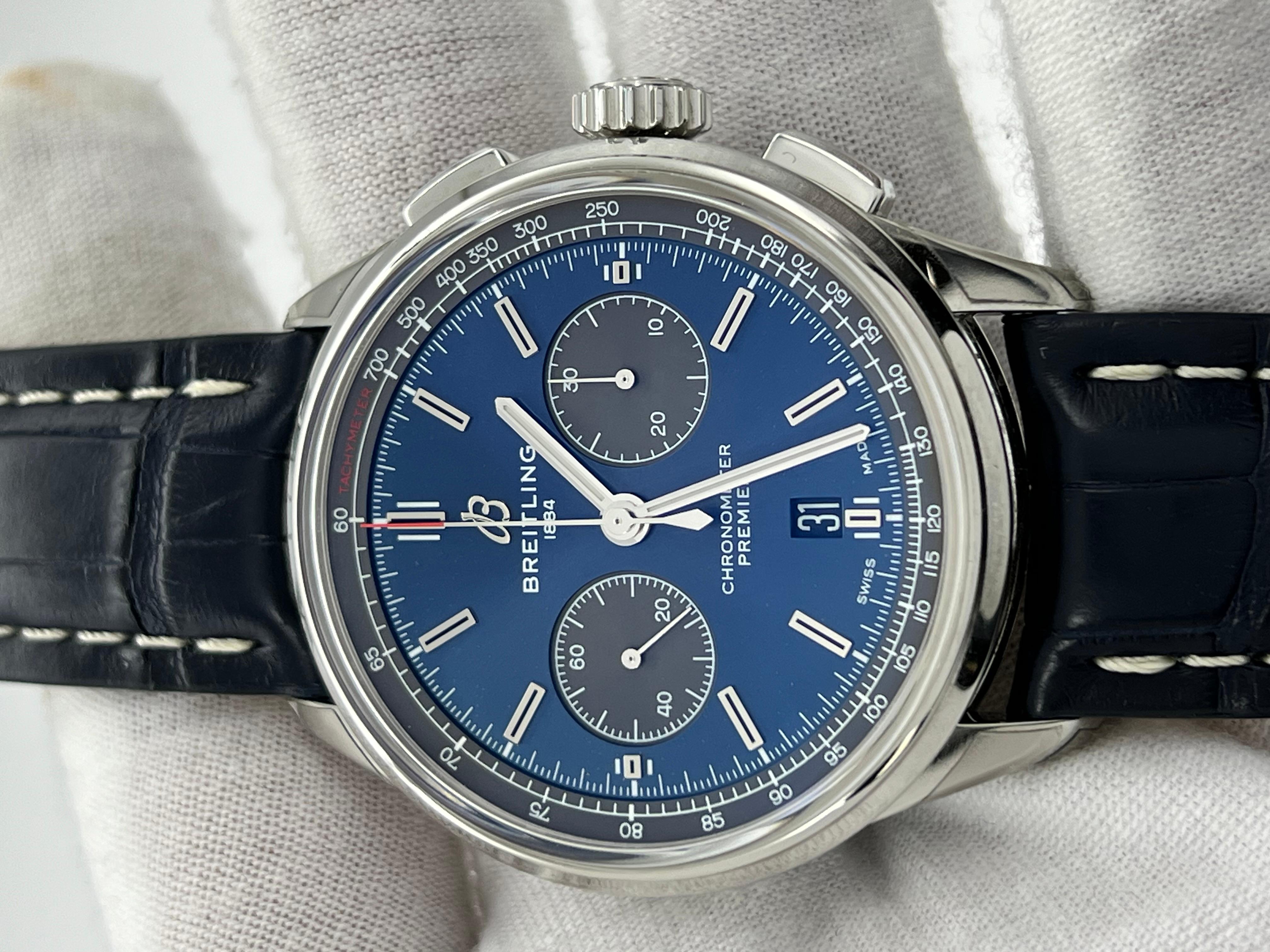 Style Number: AB0118
Year: 2019
Model:  Breitling Premier B01 Chronograph 42
Case Material: Stainless Steel 
Band: Black Leather Band
Bezel:  Stainless Steel Smooth Bezel 
Dial: Blue 
Face: Sapphire Crystal 
Case Size: 42mm 
Includes: 
-Travel