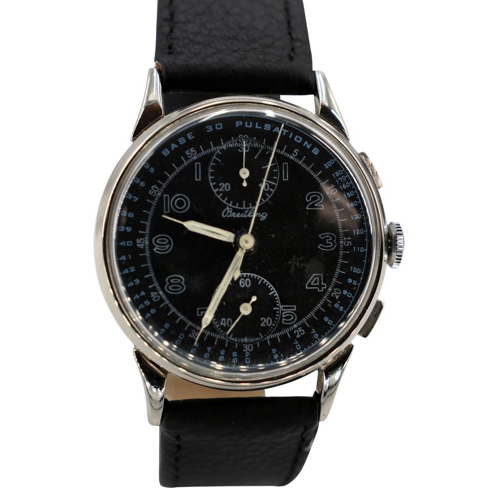 GRAND CHRONOGRAPHE-BRACELET BREITLING POUR HOMME, CADRAN NOIR, CIRCA 1950 : 

CADRAN : Beau cadran noir rénové en parfait état comme le montrent les photos, sous-cadran pour les secondes constantes, sous-cadran pour le registre des minutes et jeu