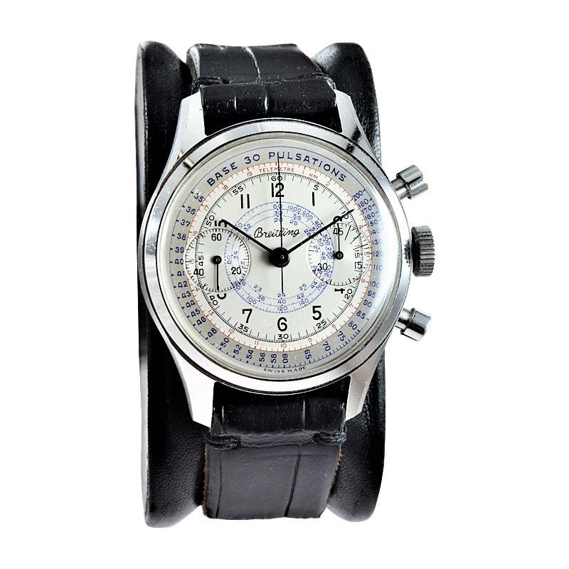 FACTORY / HOUSE: Breitling Watch Company
STYLE / REFERENCE: Two Register Drs. Pulsation Chronograph
METAL / MATERIAL: Stainless Steel 
DIMENSIONS: 44mm X 36mm
CIRCA: 1940's
MOVEMENT / CALIBER: Manual Winding / 17 Jewels 
DIAL / HANDS: Original Blue