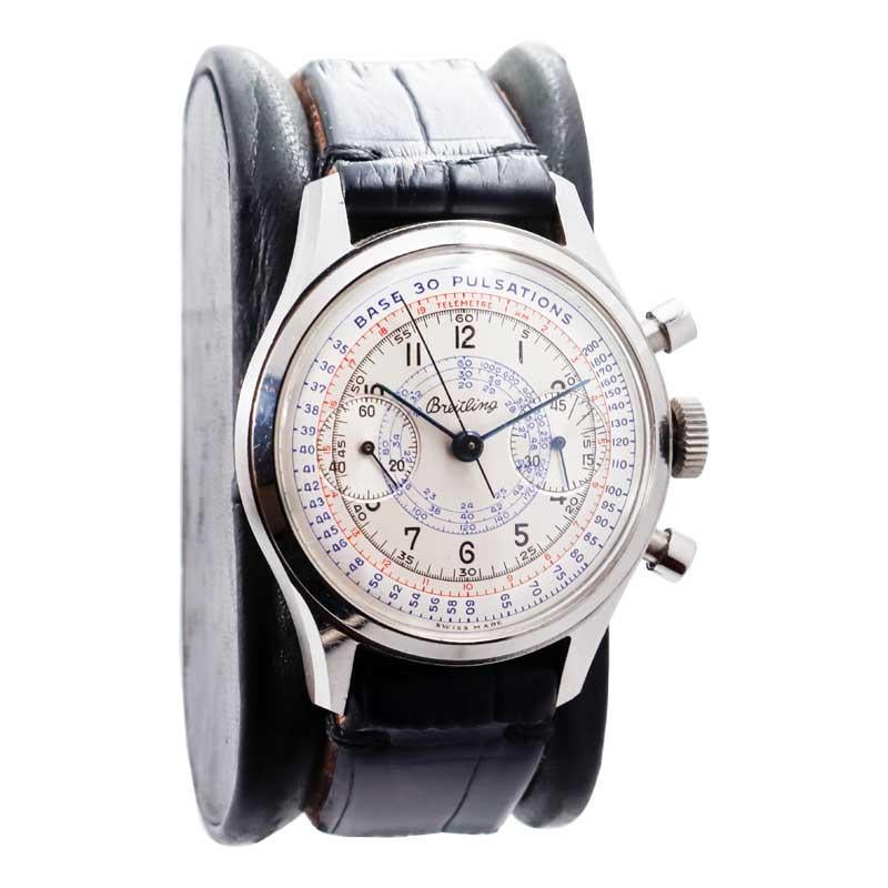 FACTORY / HOUSE: Breitling Watch Company
STYLE / REFERENCE: Two Register Drs. Pulsation Chronograph
METAL / MATERIAL: Stainless Steel 
DIMENSIONS: Length 44mm X Diameter 36mm
CIRCA: 1940's
MOVEMENT / CALIBER: Manual Winding / 17 Jewels 
DIAL /