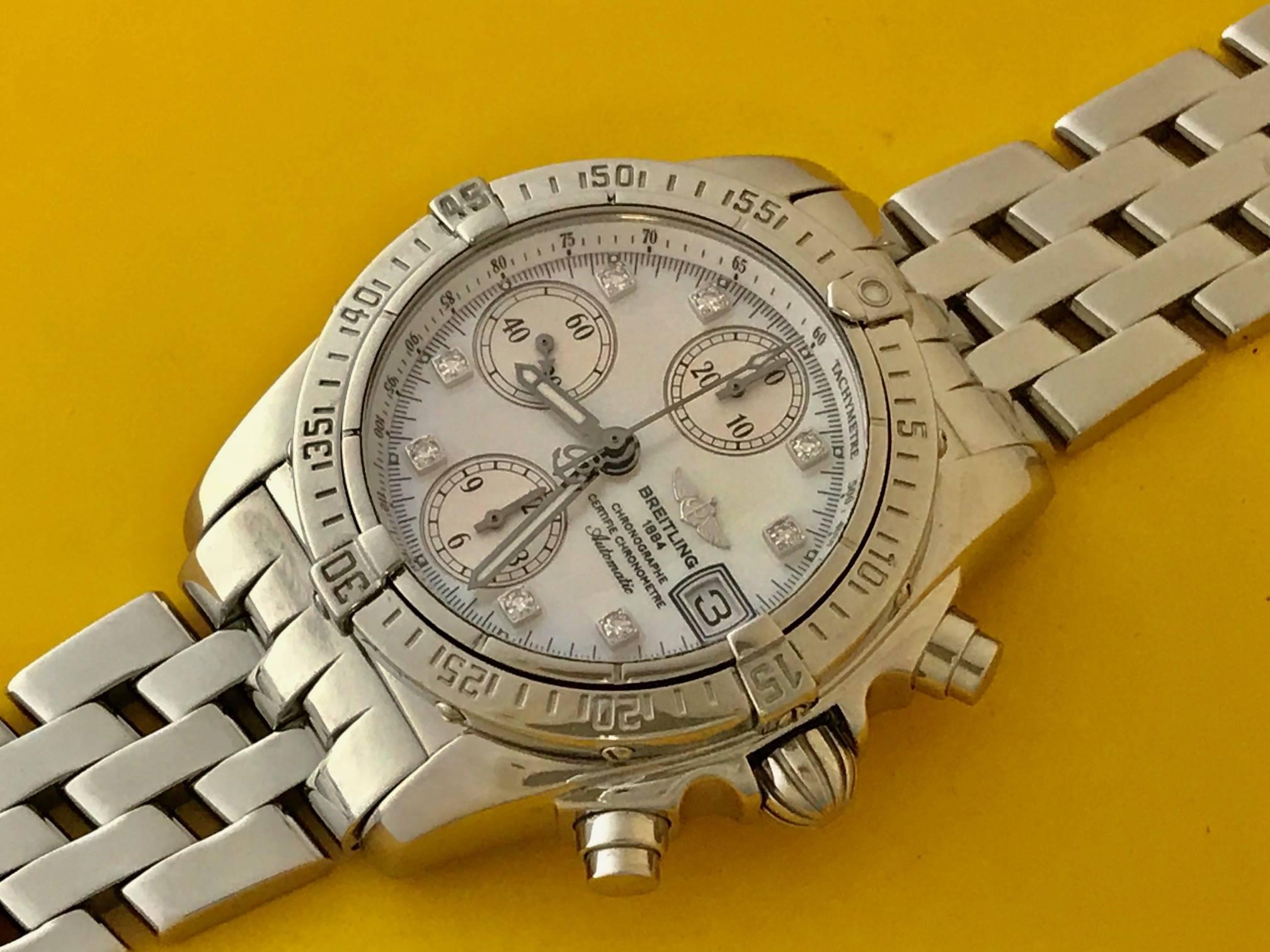 Breitling Chrono-Cockpit Stainless Steel and Diamond Wristwatch Ref A1335712. Certified Pre Owned and ready to ship! This watch can easily be worn by men and ladies. Automatic Winding with Date and Breitling factory Mother of Pearl Dial with Diamond