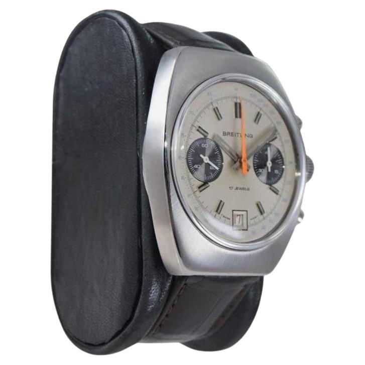 FACTORY / HOUSE: Breitling Watch Company
STYLE / REFERENCE: Tonneau Shape /  Chronograph
METAL / MATERIAL: Stainless Steel 
DIMENSIONS: Length 43mm X Width 37mm
CIRCA: 1970's
MOVEMENT / CALIBER: 17 Jewels / Caliber 7730
DIAL / HANDS: Factory