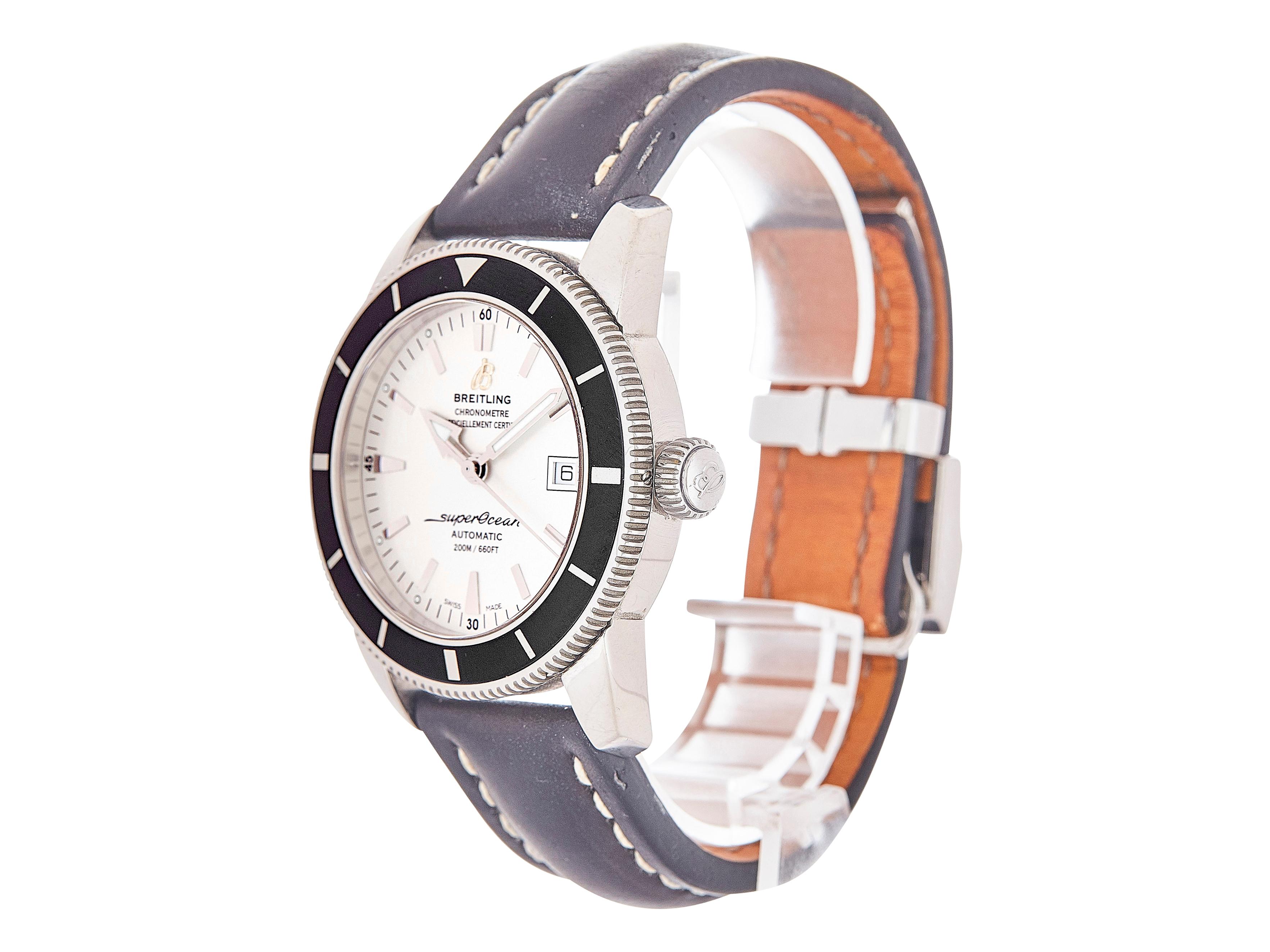 This Breitling Superocean Heritage watch(A1732124/G71) is crafted in stainless steel, branded leather strap, and an additional branded rubber strap/buckle. It features a silver dial, stainless steel bezel, and a deployant clasp as well. The sapphire