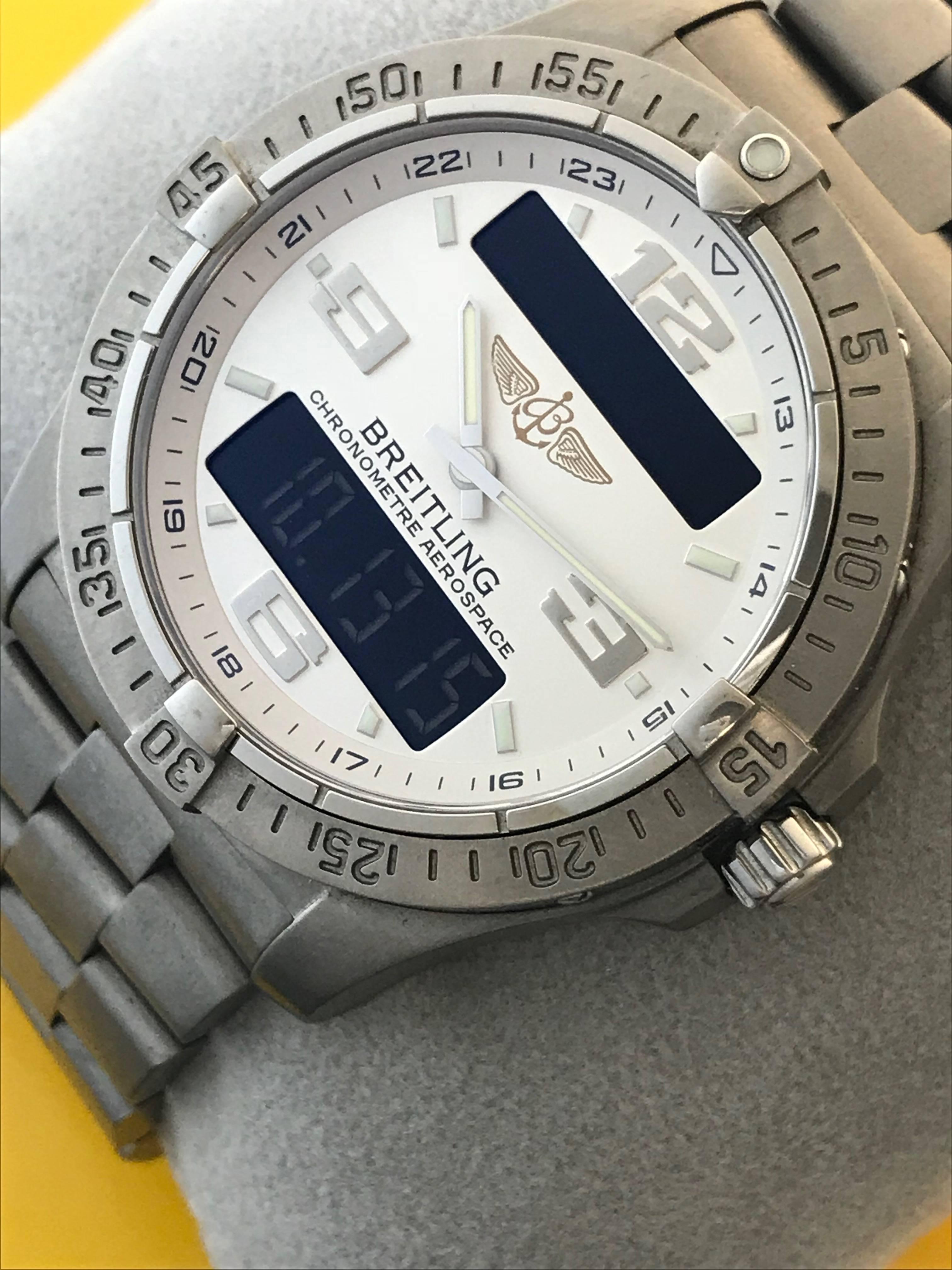 Breitling Aerospace Avantage Men's Titanium Quartz GMT Men's wrist watch. Model E7936210/G606. Certified pre-owned and ready to ship! Features Chronograph, GMT 2nd Time Zone and Alarm, Perpetual Day and Date Calendar, Electronic and Analog LCD
