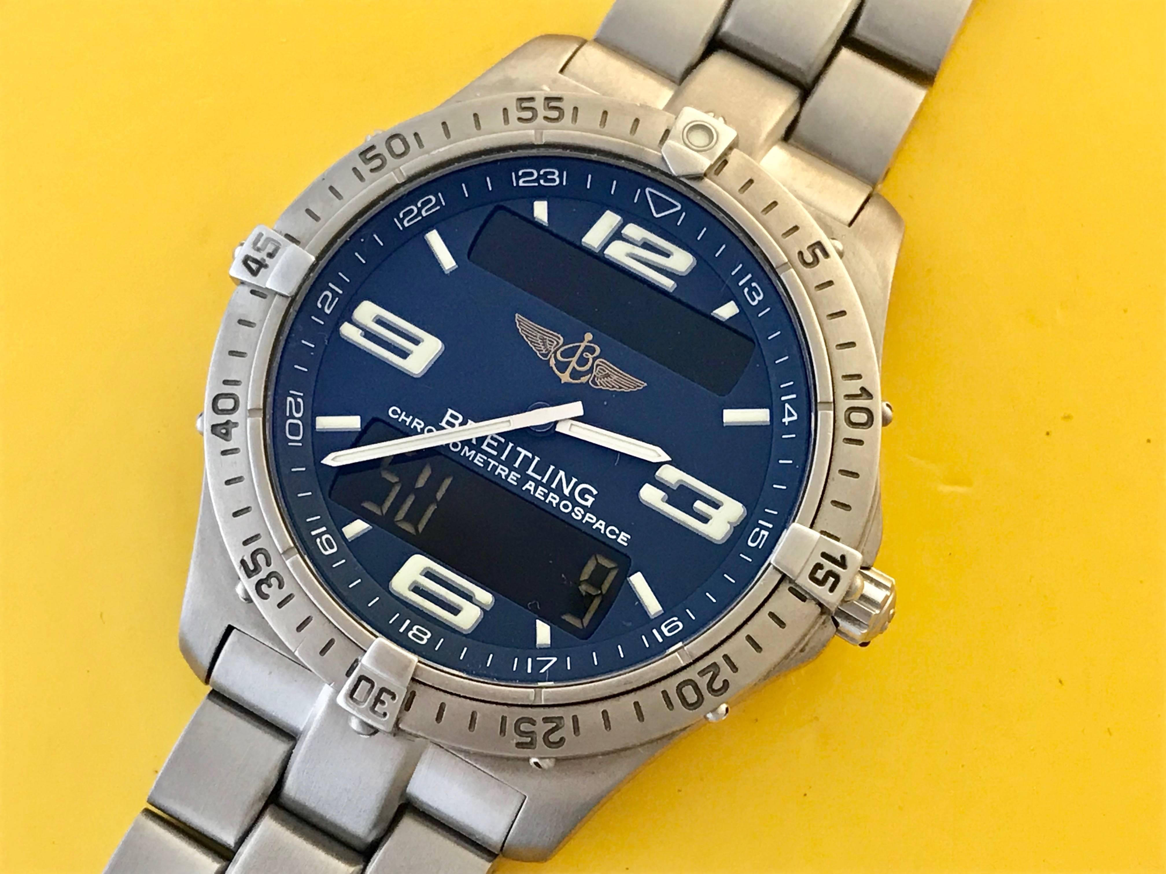 Breitling Aerospace Men's Titanium Quartz wrist watch. Model E75362. Certified pre-owned and ready to ship! Dark blue Dial with white Arabic numerals, Titanium case (41mm dia.). Water resistant to 100 Meters. Titanium Breitling bracelet with